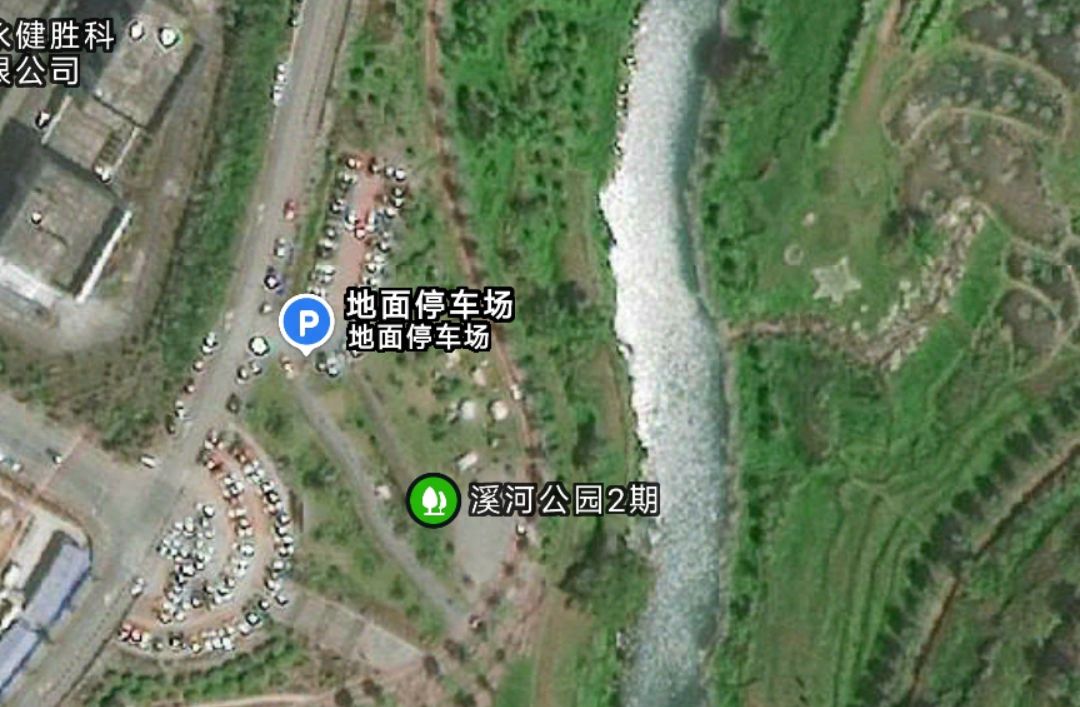 Navigate to Zhuxihe Wetland Park (southeast 460 meters at the intersection of Wanfu Road auxiliary road and Yunsheng Avenue, Chongqing). After parking in the ground parking lot, enter the park and follow the riverside walkway to reach the destination. — step-by-step photo guide