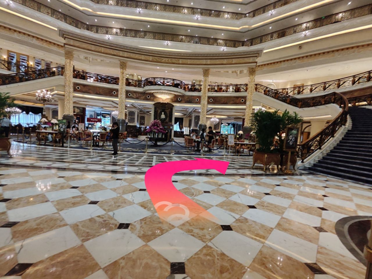 After entering the lobby, turn right and go to the fence in front on your right. — step-by-step photo guide