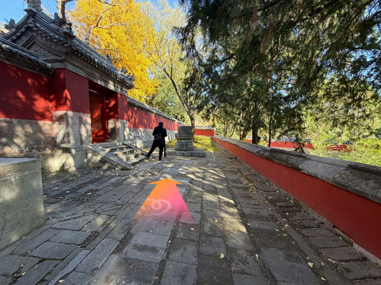 Go straight and head towards the red wall on your left. — step-by-step photo guide