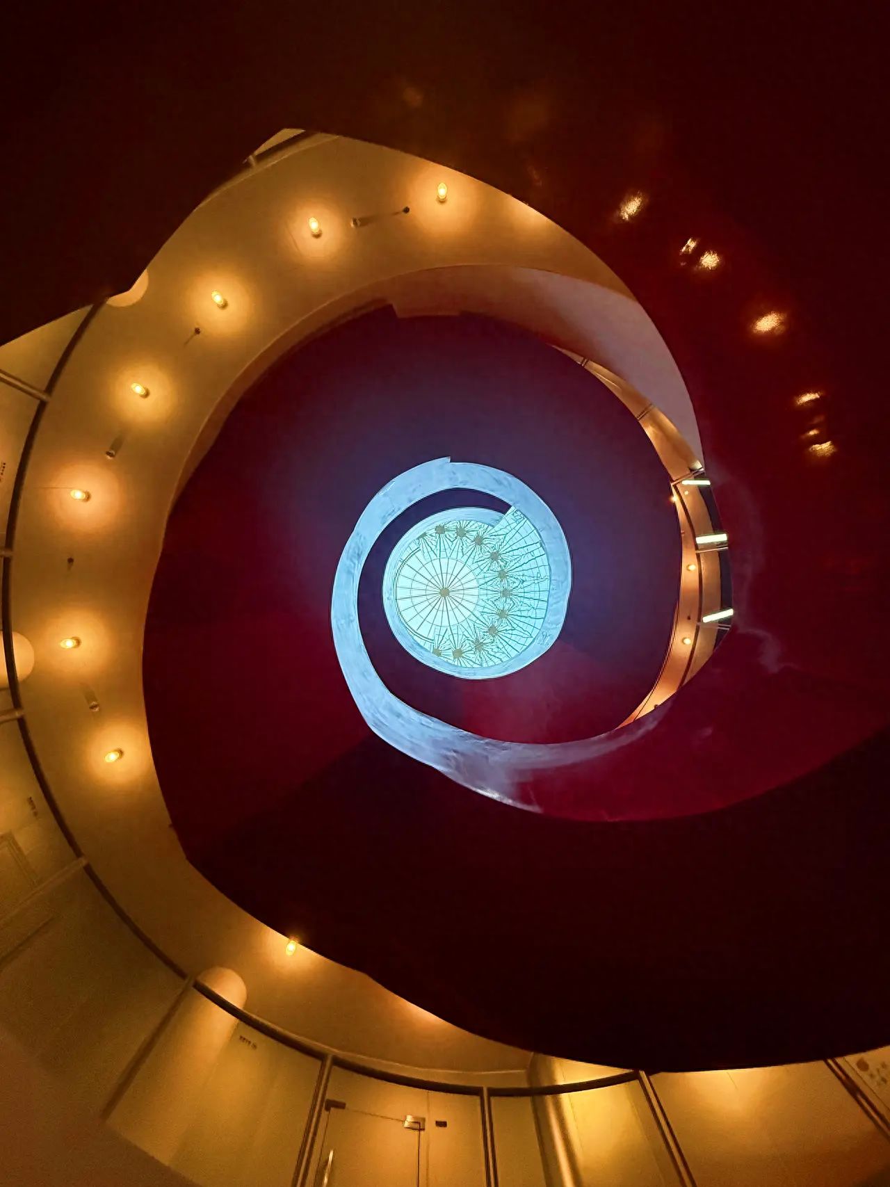 Photo by Zhongguancun SOHO - Red Rotating Staircase