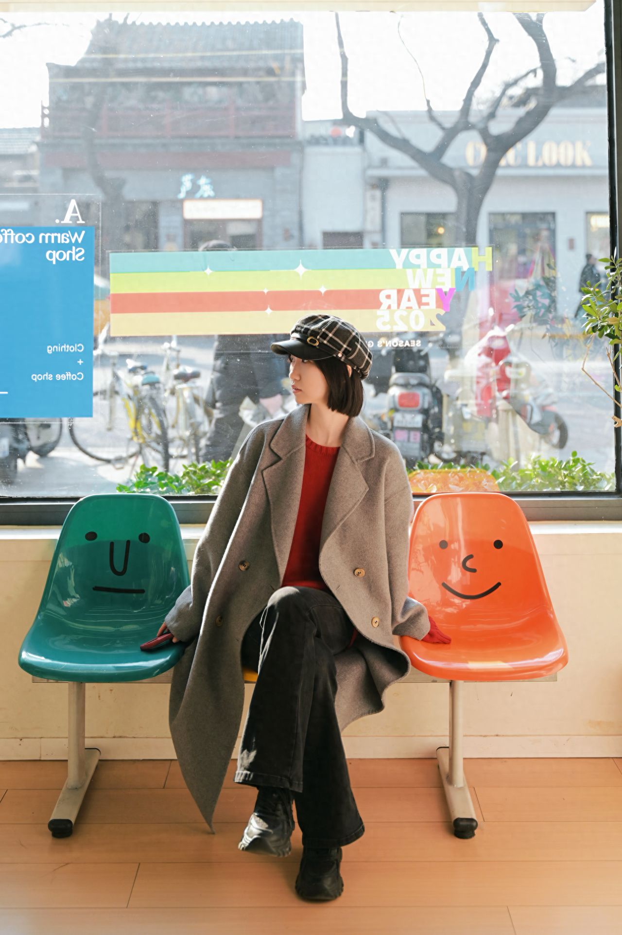 Positioning suggestion: The model sits on the colorful seat, and the photographer stands 1 meter away from the model.

Composition suggestion: The photographer should frame the model's full body, placing the model in the center of the composition with space for headroom.

Shooting time: It is recommended to shoot in the afternoon for natural and soft lighting.

Equipment used: This image was captured using a Nikon Z62 with a 28-75mm lens.

Outfit suggestion: Wear a brightly colored dress or hoodie.

Pose suggestion: The model sits on the colorful seat with hands naturally resting on both sides.