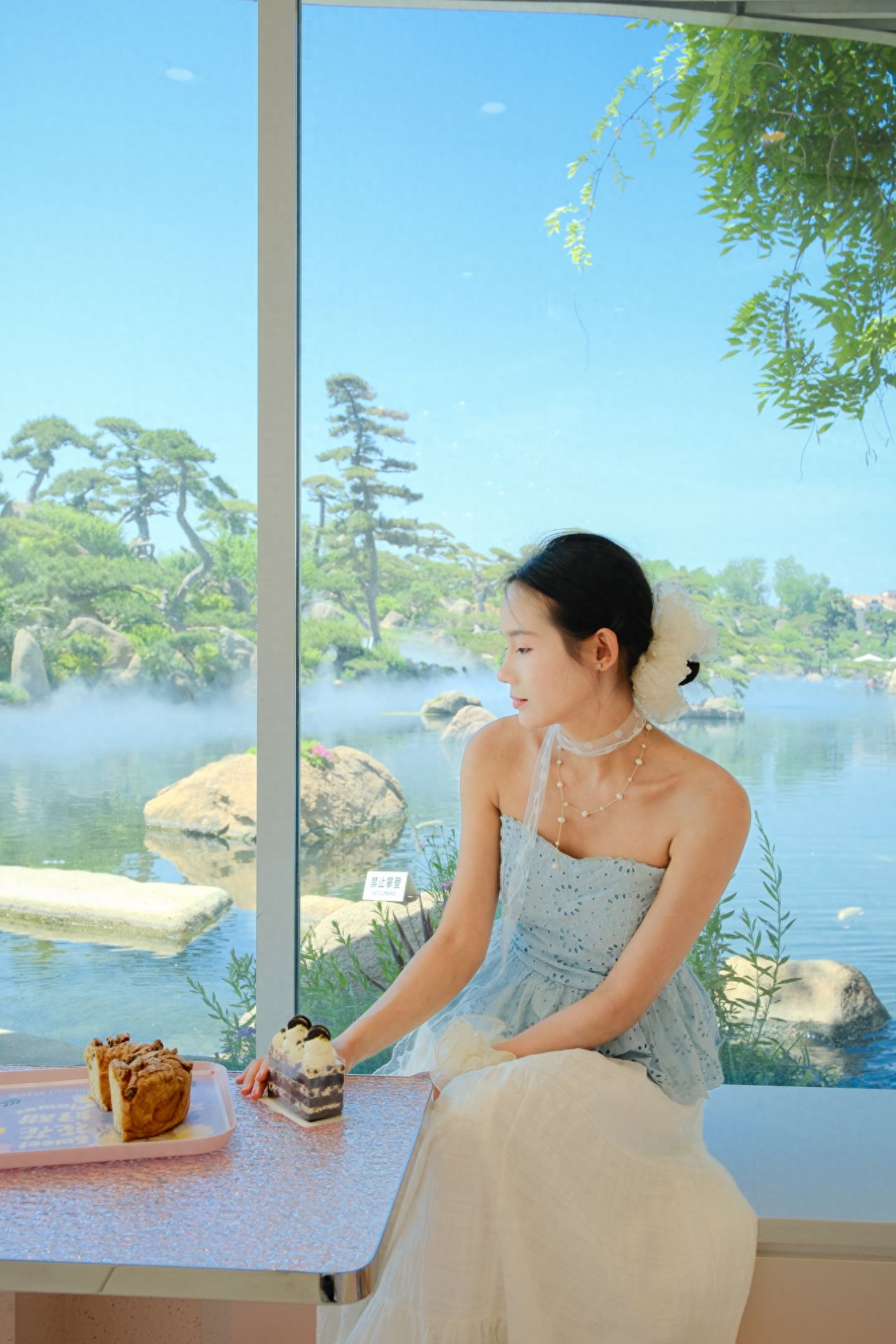 Photo by Luo Hong Photography Art Museum - in front of the floor-to-ceiling windows at the café