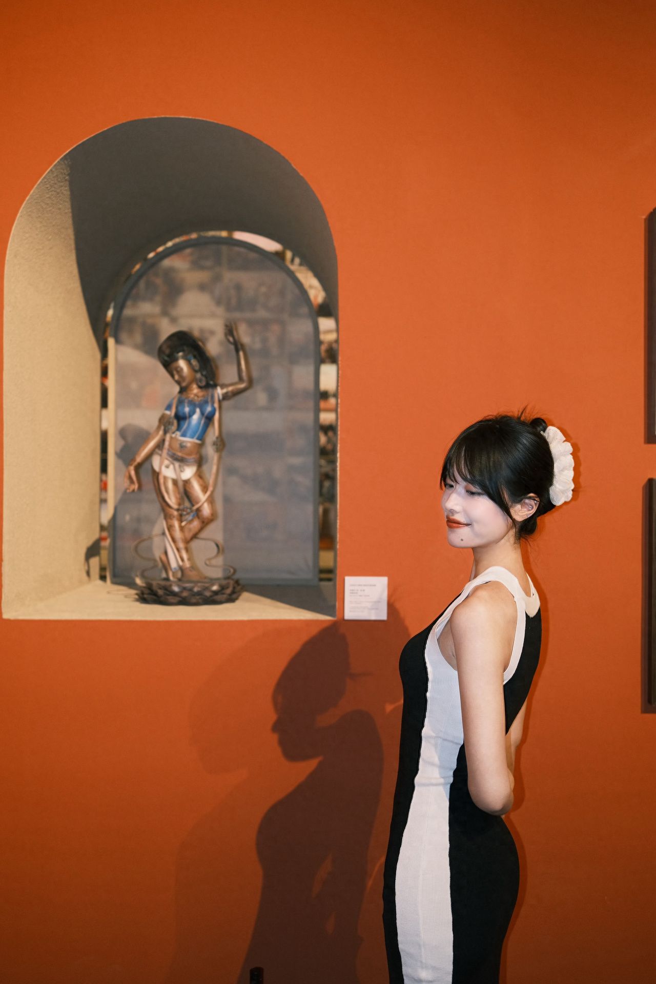Photo by China National Arts and Crafts Museum - Red Wall Arched Frame Sculpture