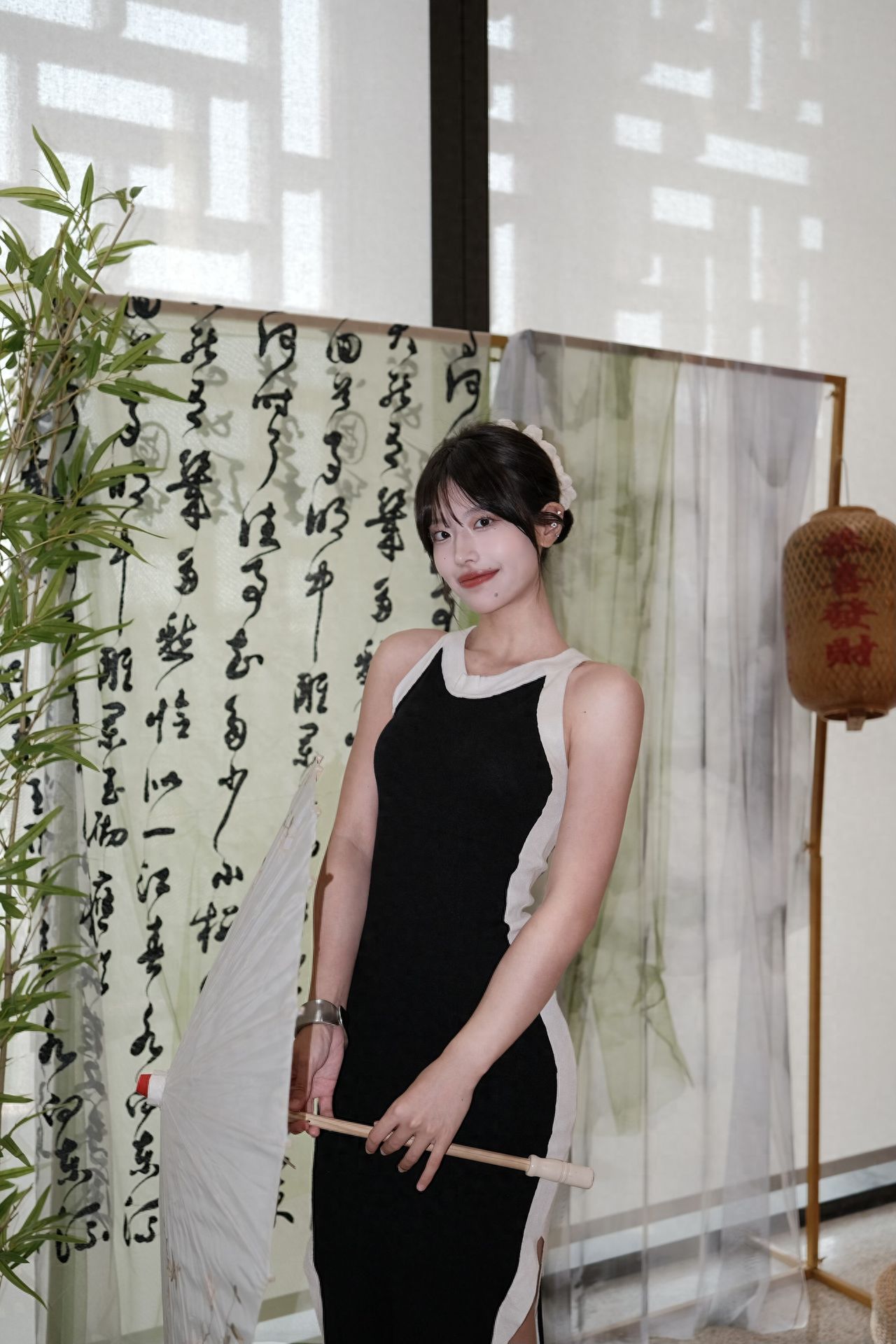 Photo by China National Arts and Crafts Museum - in front of a Chinese-style folding screen