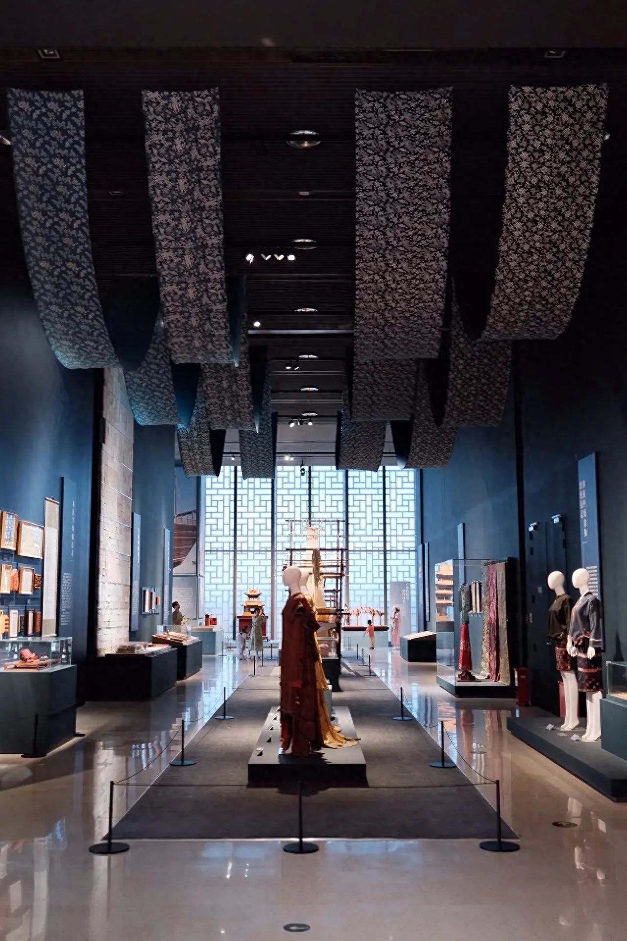 Photo by China National Arts and Crafts Museum - Mannequins in Traditional Attire and Cultural Relics