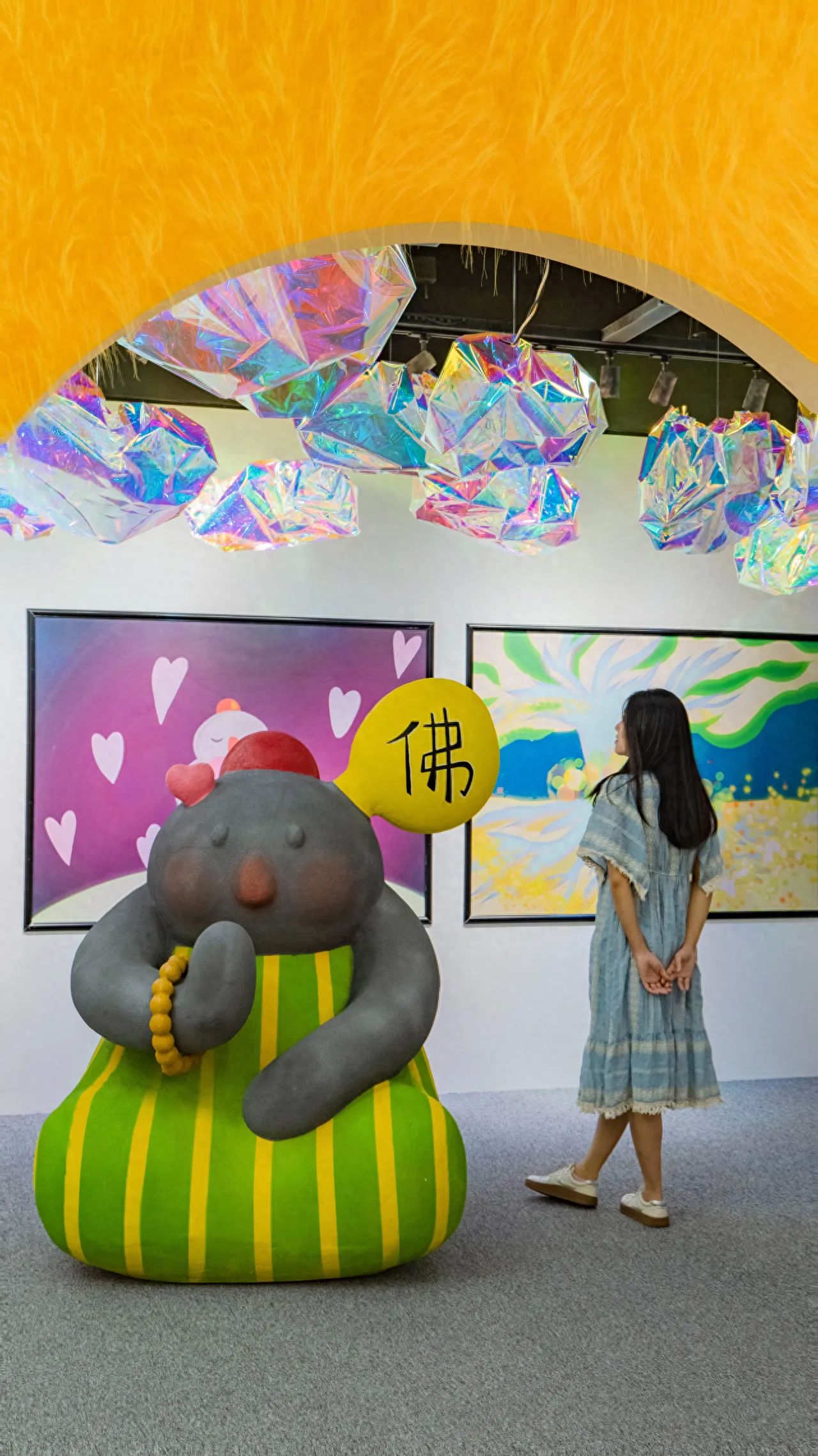 Wangfujing Joy City Shopping Center - Take a photo with the cartoon Buddha statue. — photo spot in Wangfujing Joy Shopping Center (B2 South Gate 1), China