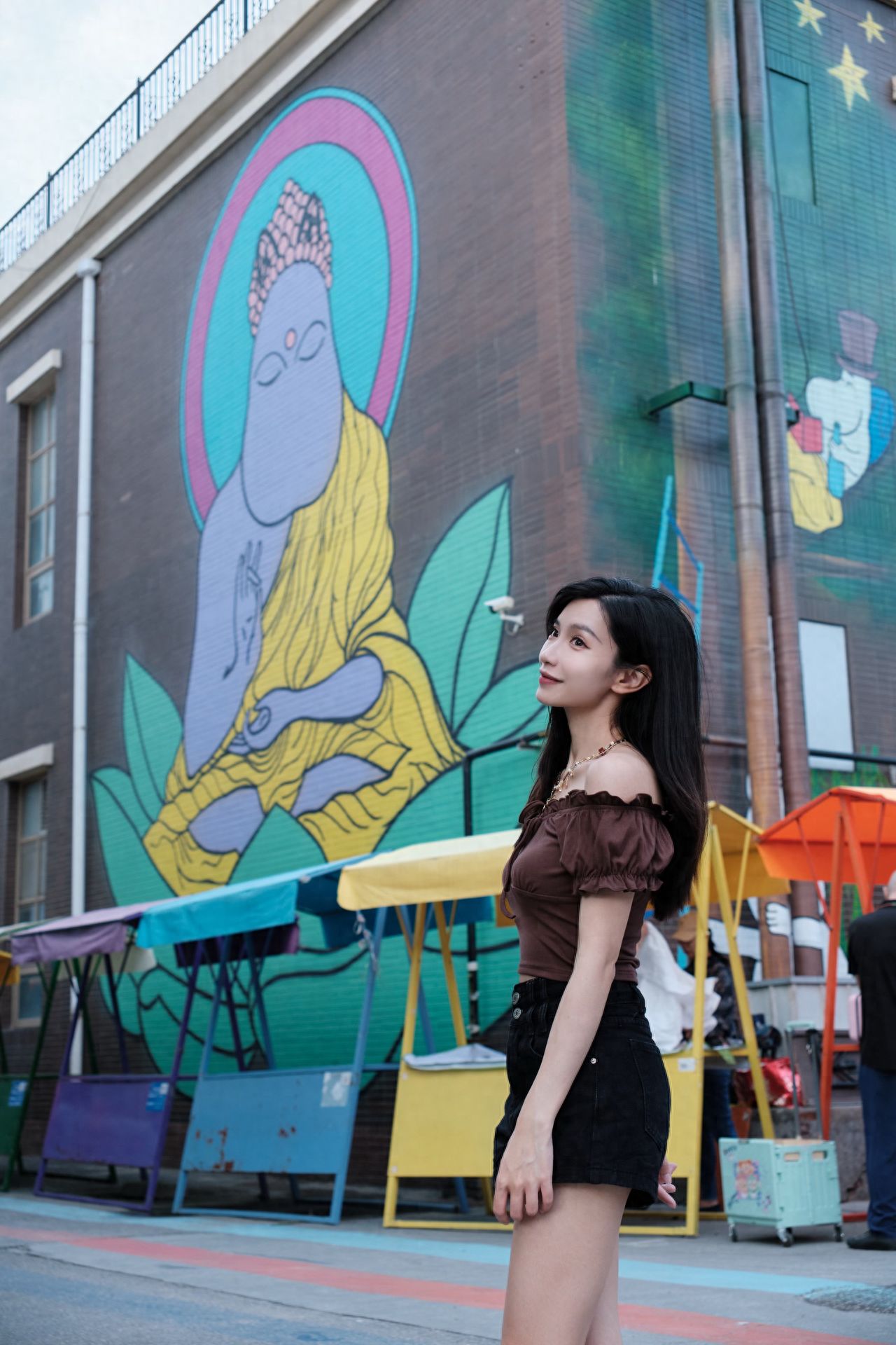 Photo by Moon River Art Town - Cartoon Buddha Wall