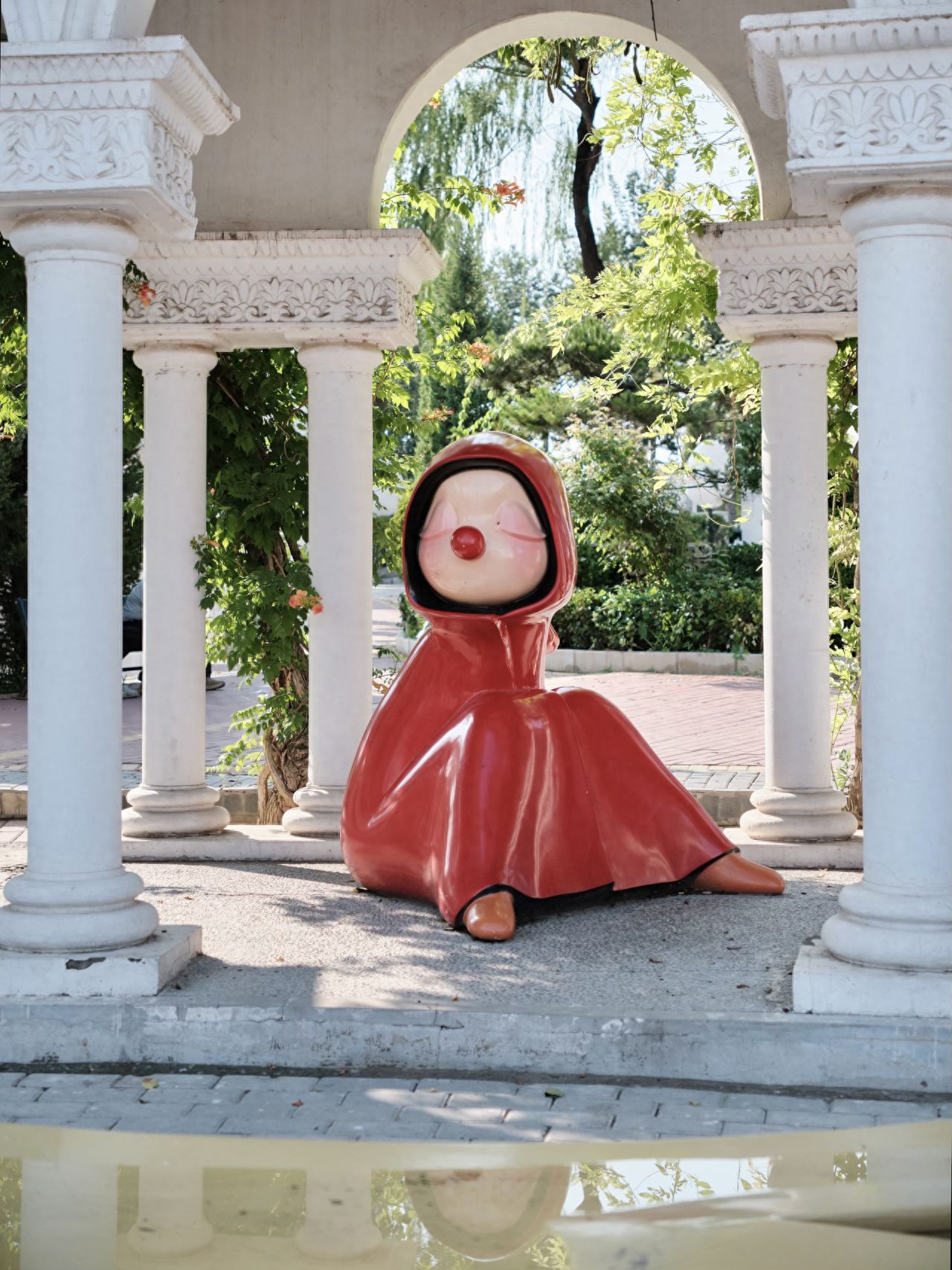 Photo by Moon River Art Town - Seated Humanoid Cartoon Installation