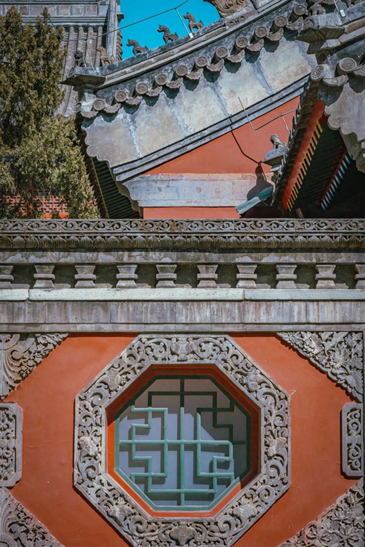 Photo by Beijing Wanshou Temple - Red Wall, Traditional Chinese Window Grills, and Architectural Eaves