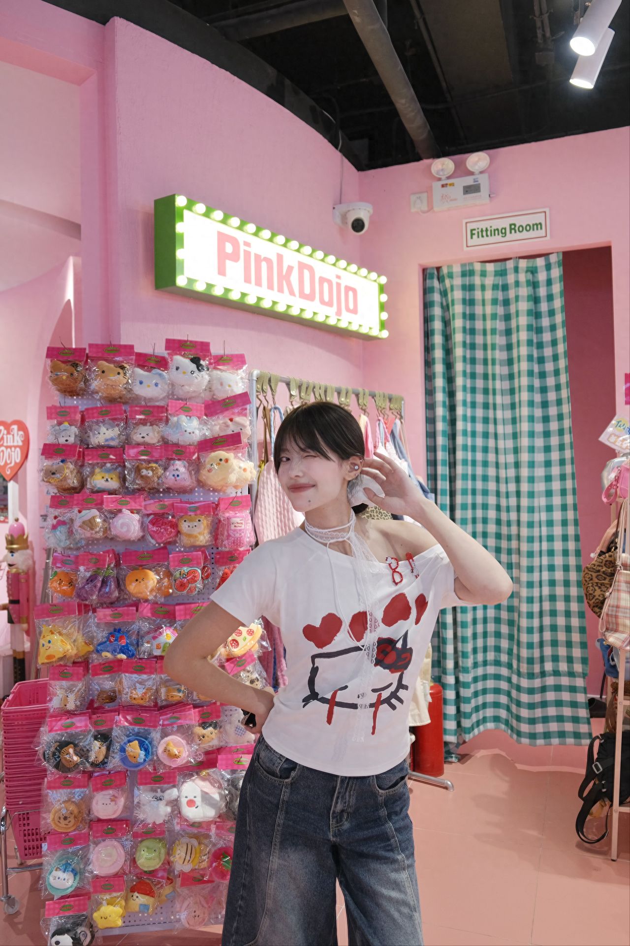 Photo by PinkDojo - in front of the pink shelves