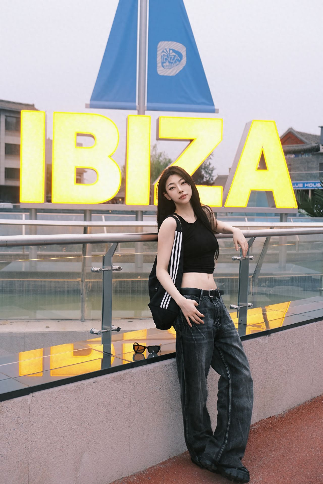 Photo by Huashanyuan - In front of the glass fence with yellow letter sign