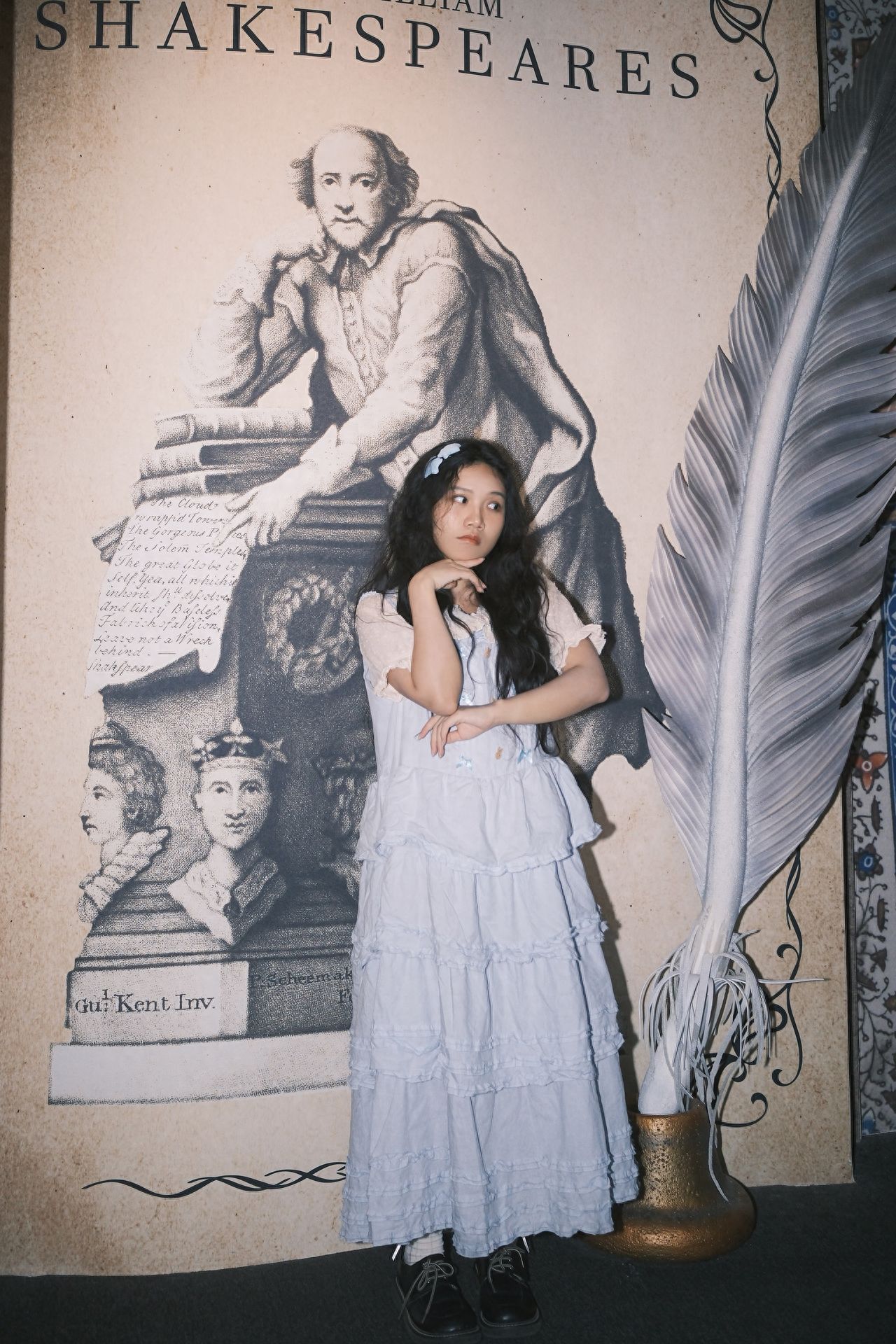 Photo by In front of the portrait of William Shakespeare at the British Library in Beijing.