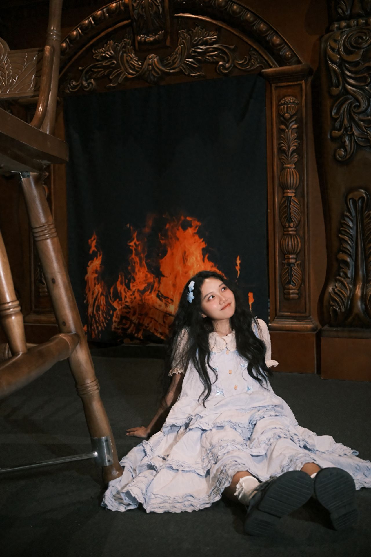 Photo by Beijing's British Library - Behind the Giant Chair in the Land of Giants, a Simulated Fireplace