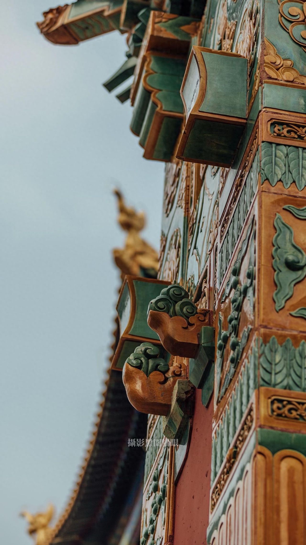 Photo by Zongjing Dasheng Temple - the protruding glazed tile decorations on the walls