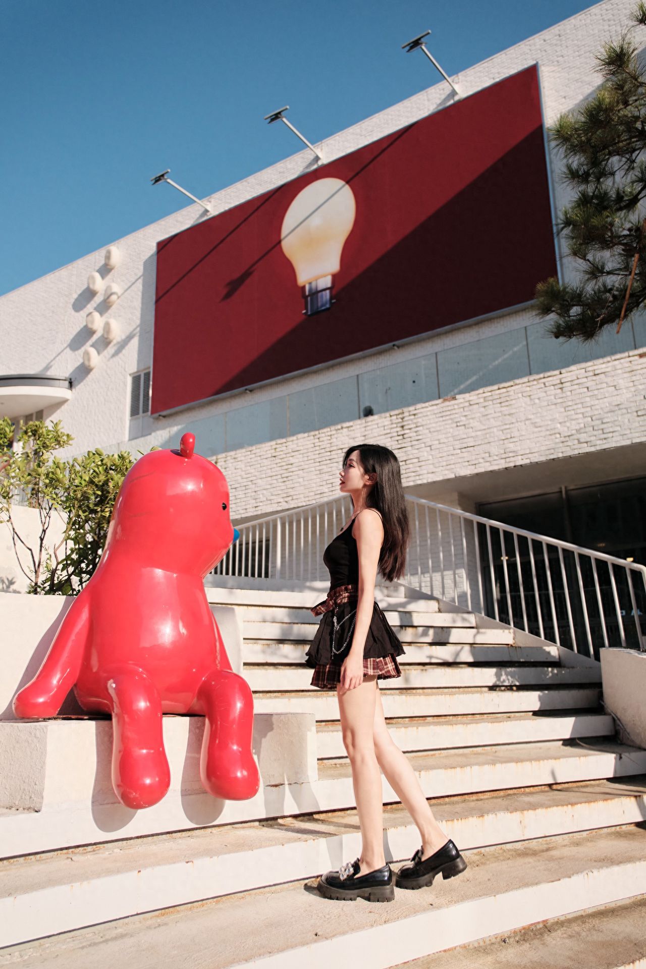Photo by Moon River Art Town - Red Sculpture on the Staircase