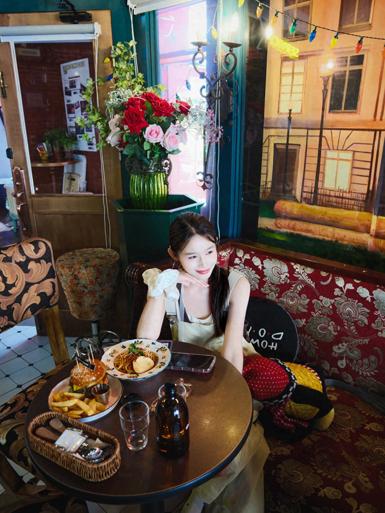 Photo by Friends Tavern - Sofa in front of the mural