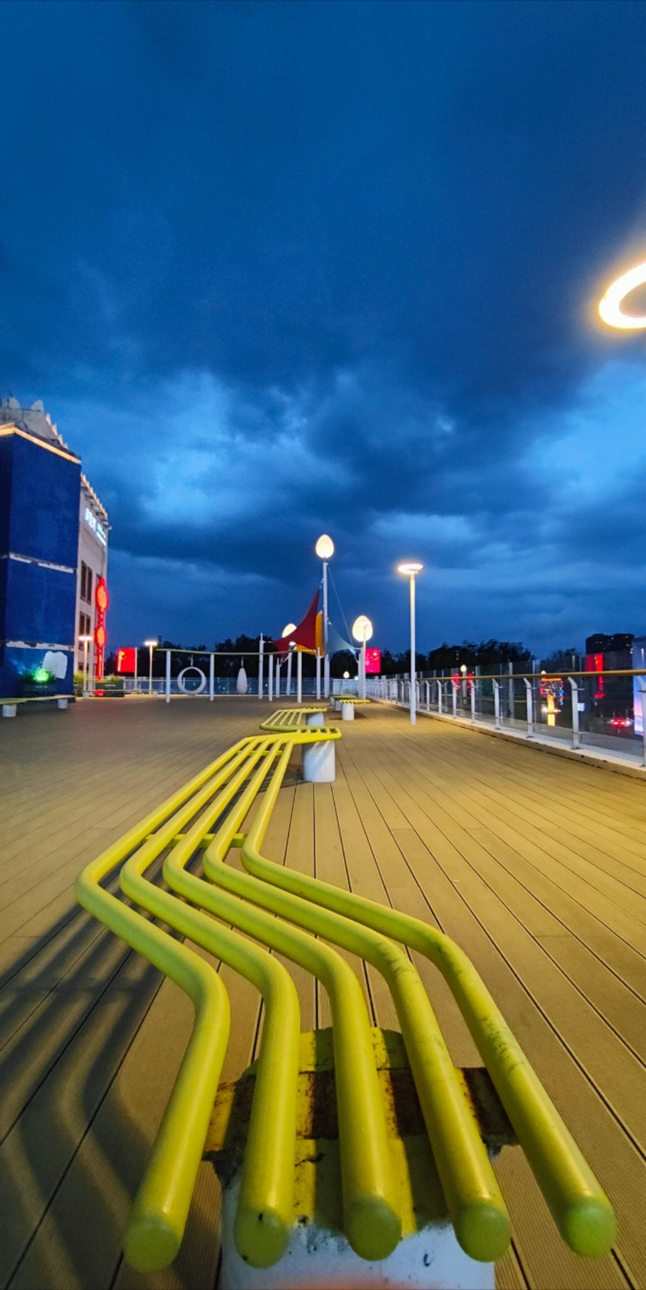 Photo by Moon River Town - Yellow Bench and Night View