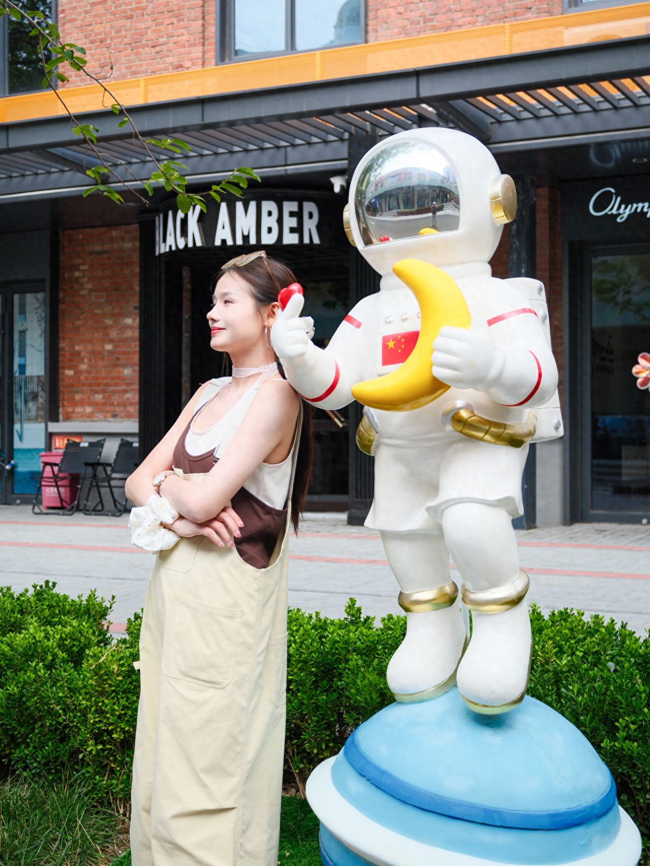Photo by Beijing Satellite Manufacturing Factory Science and Technology Park - Holding Moon Astronaut Statue
