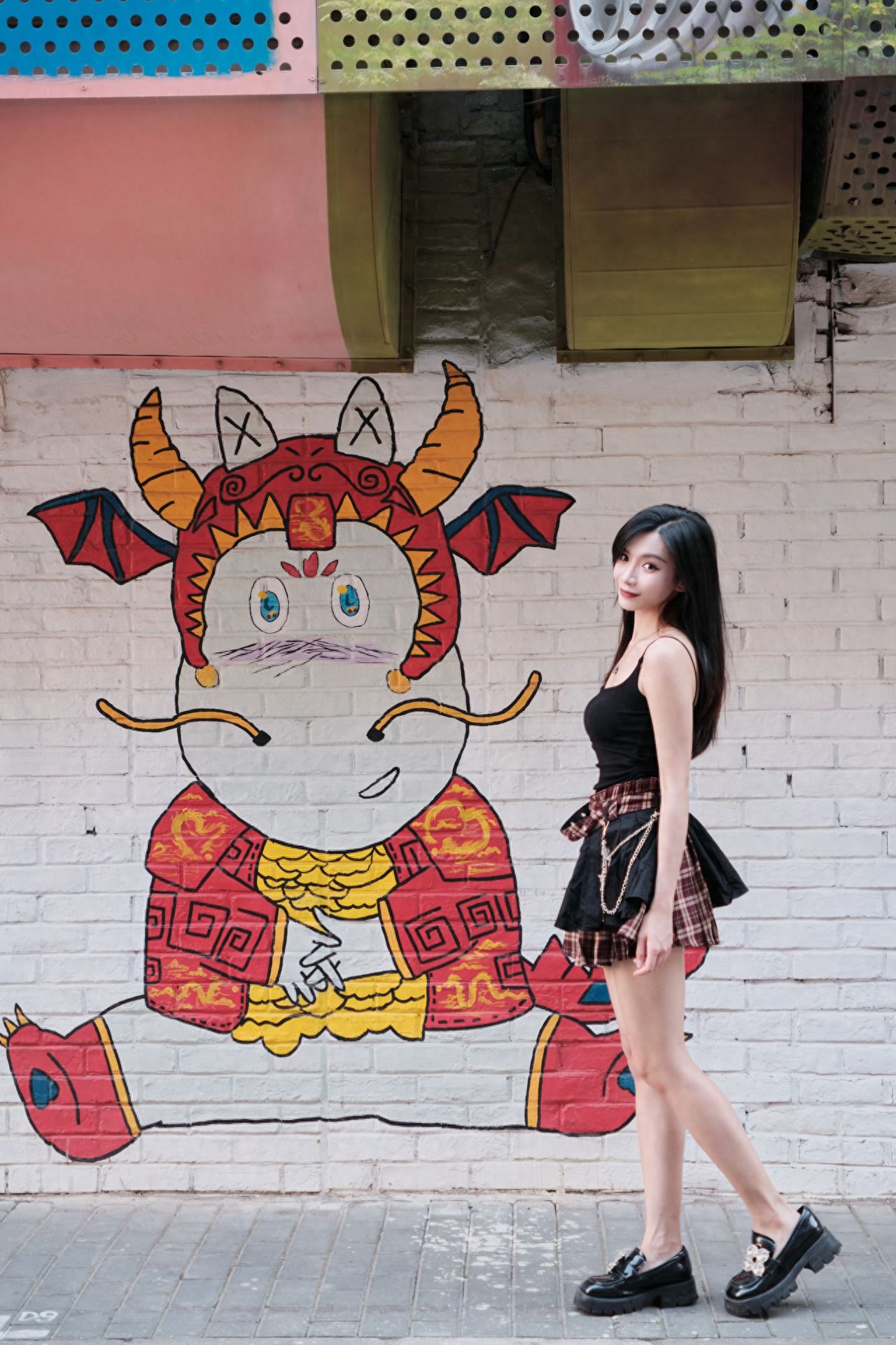 Photo by Moon River Art Town - Red Seated Little Dragon Mural