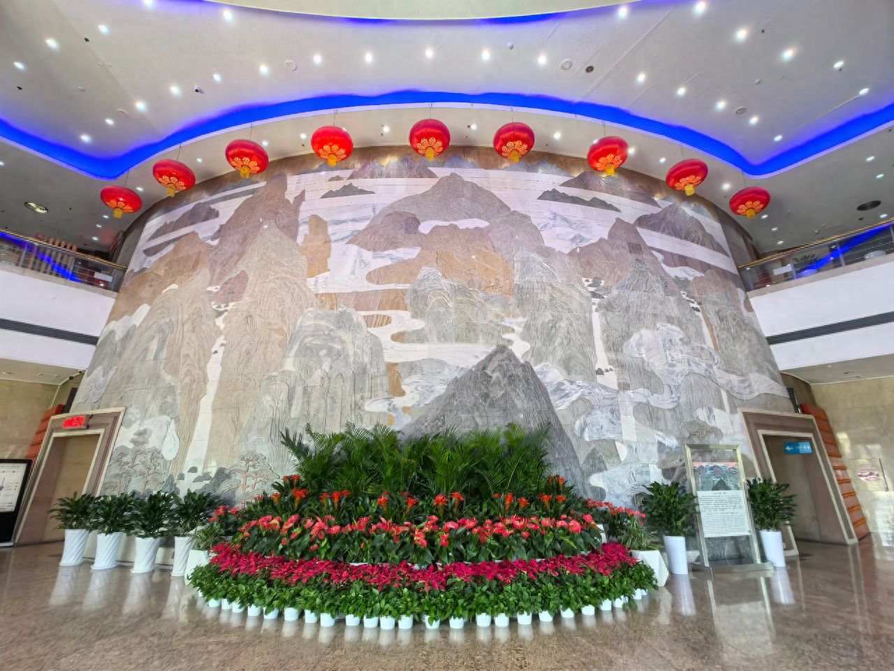 Photo by Central TV Tower - Relief Wall and Flower Beds with Greenery