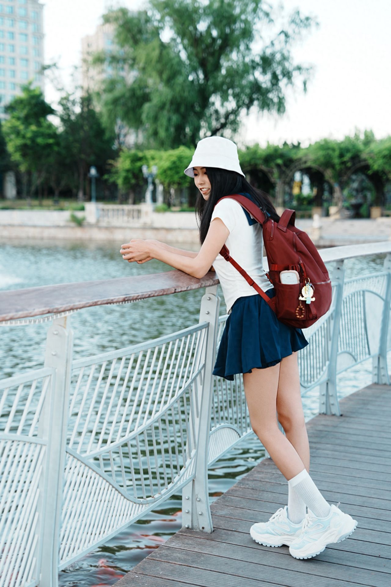 Photo by Beijing Blue Harbor - Take a photo with the railing, waterfront, and trees.