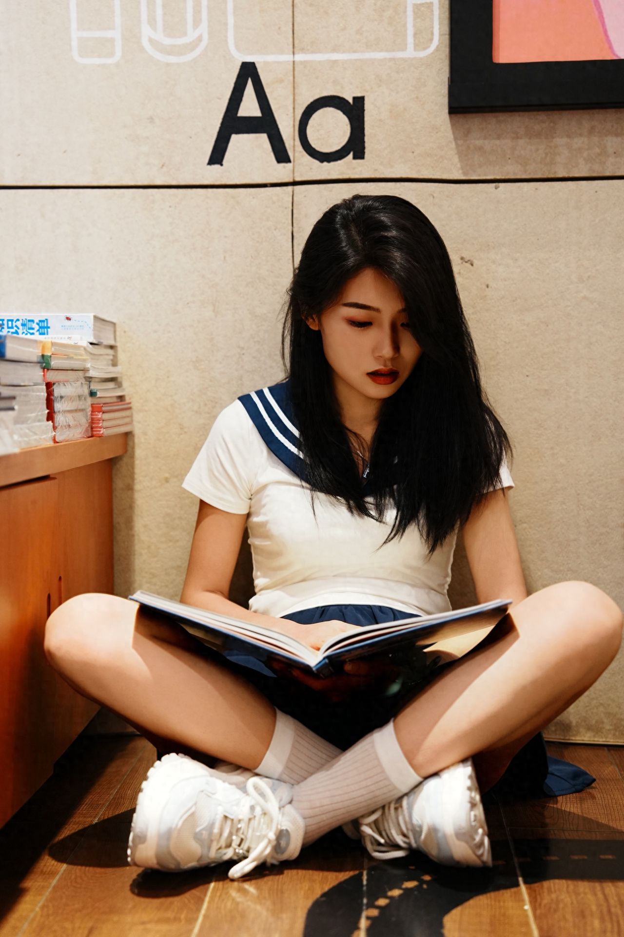 Photo by Beijing Blue Harbor Plaza - Take a photo with the books on the table and Aa.