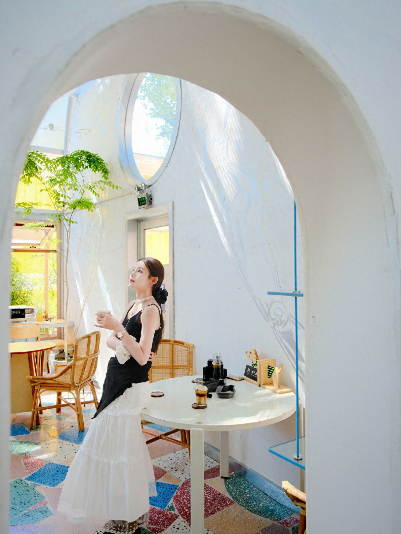 Photo by Tie Shou Coffee Friendship Store - Arch White Table