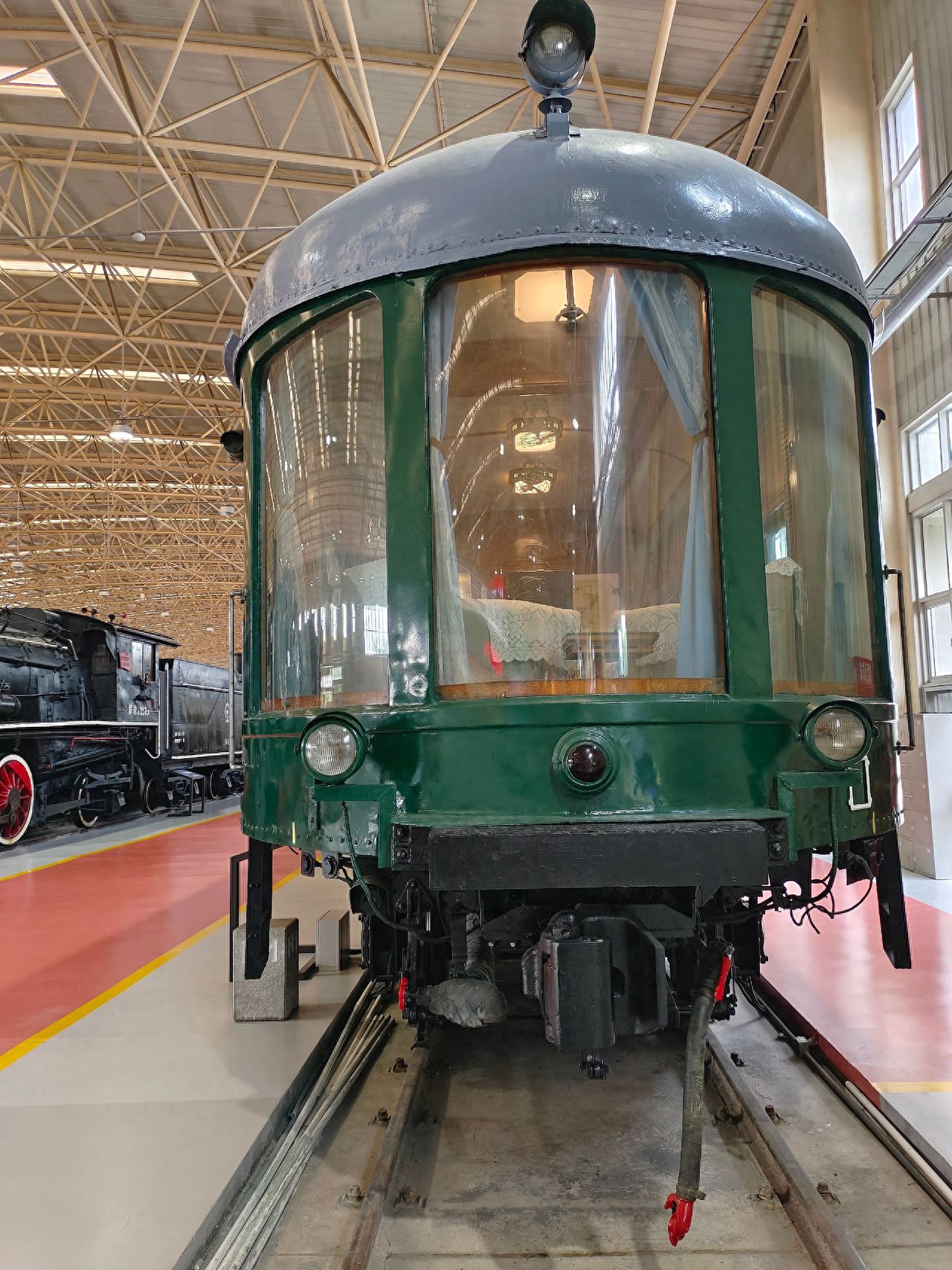 Photo by Dongjiao Railway Museum - photographing green train carriage exhibits