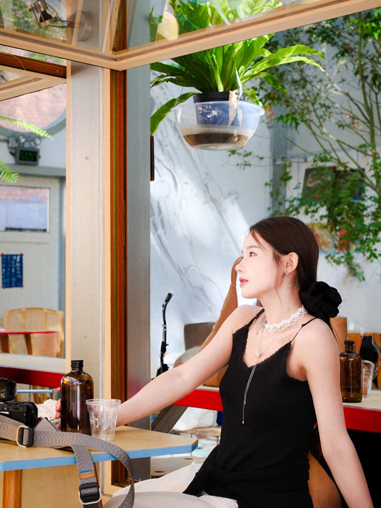 Photo by Tie Shou Coffee Friendship Garden Store - In front of the folding glass windows