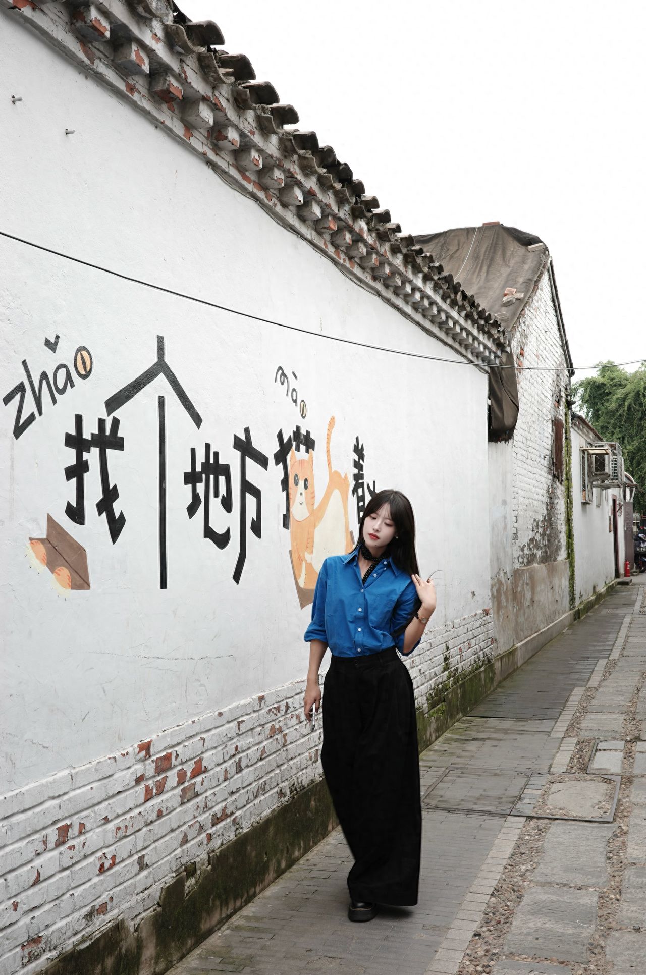 Photo by Nanman Hutong - Find a spot to lay low and head to the character wall for some graffiti.