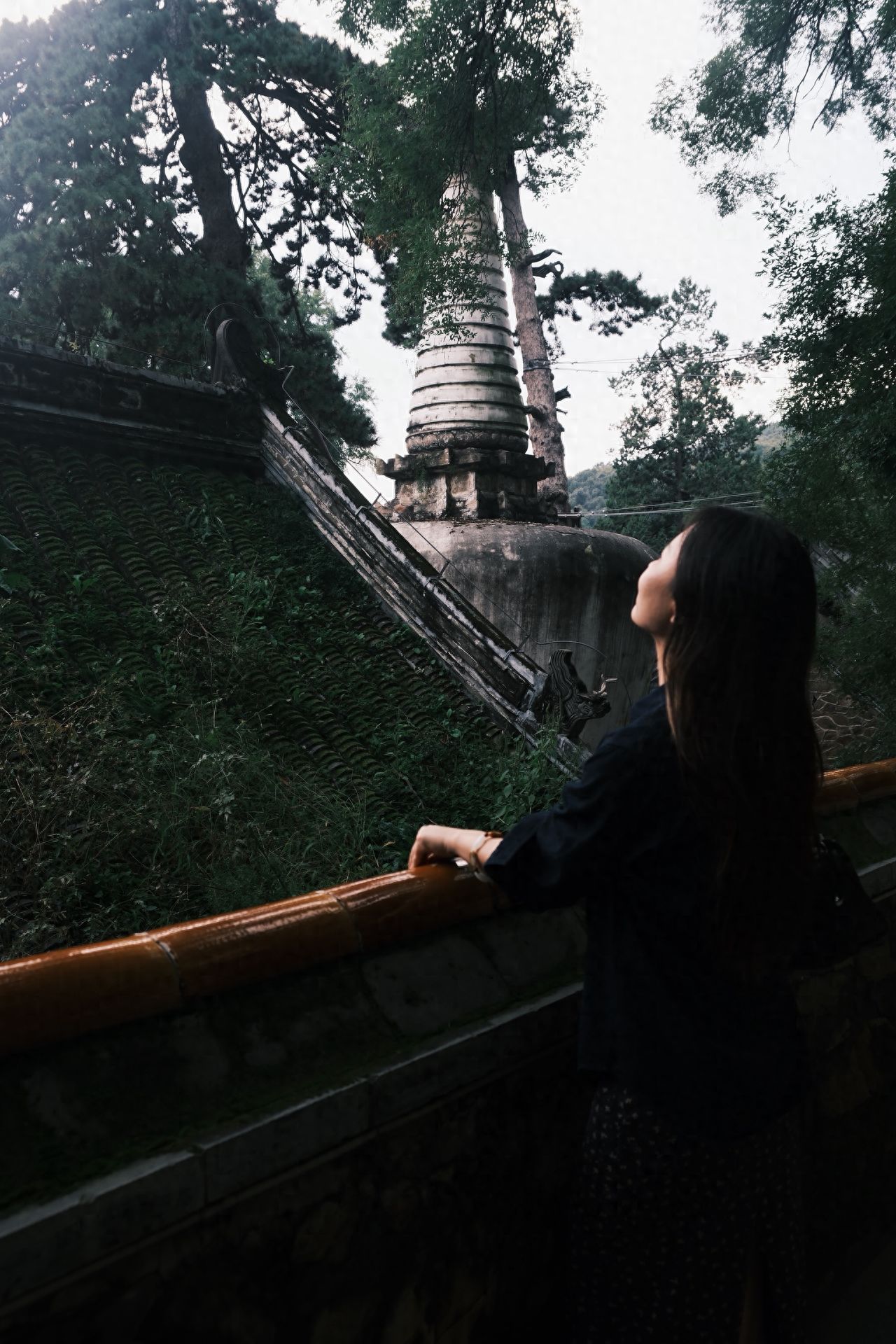 Photo by Tanzhe Temple - Take a photo with ancient pagodas, trees, railings, and rooftops.