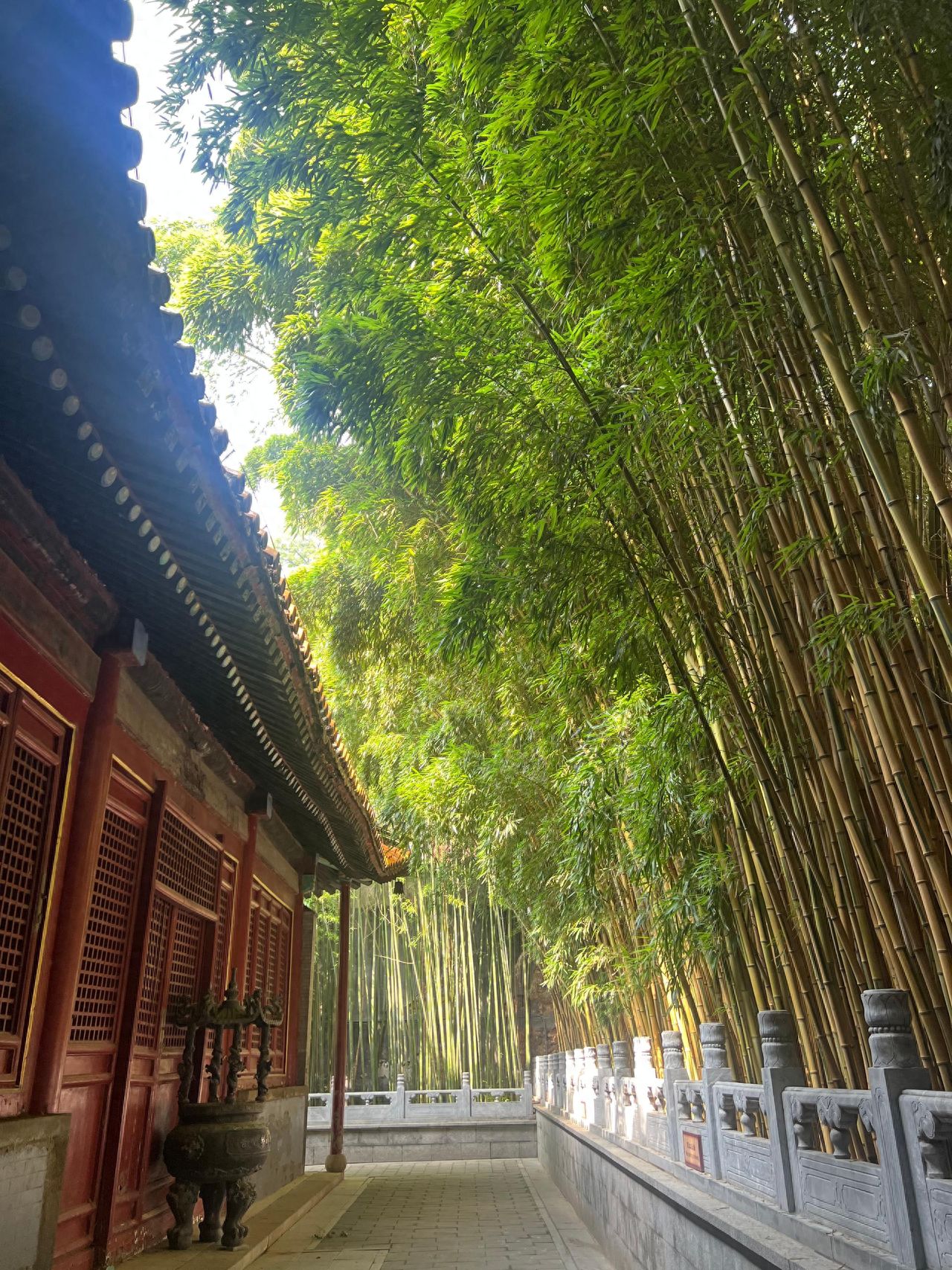 Photo by Beijing Tanzhe Temple - Bamboo Grove and Incense Burner beside the Temple Buildings