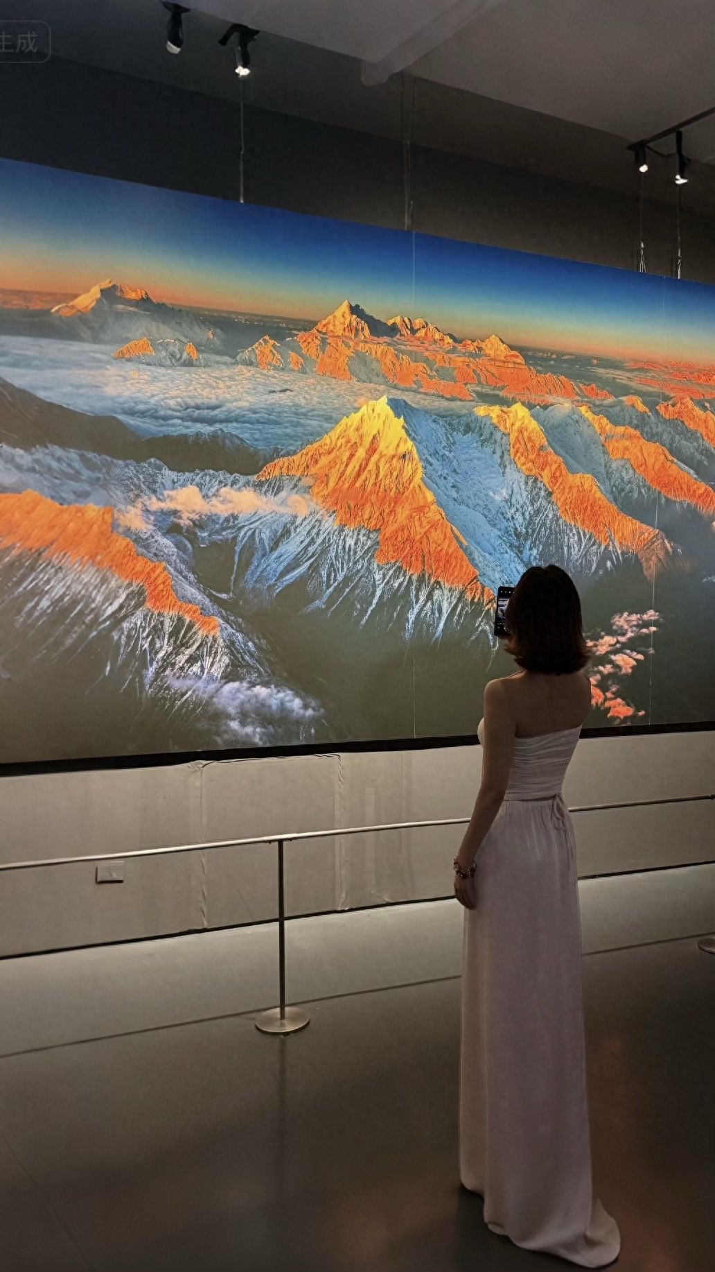 Photo by Luo Hong Photography Art Museum - Taking Photos with Snow Mountain Paintings