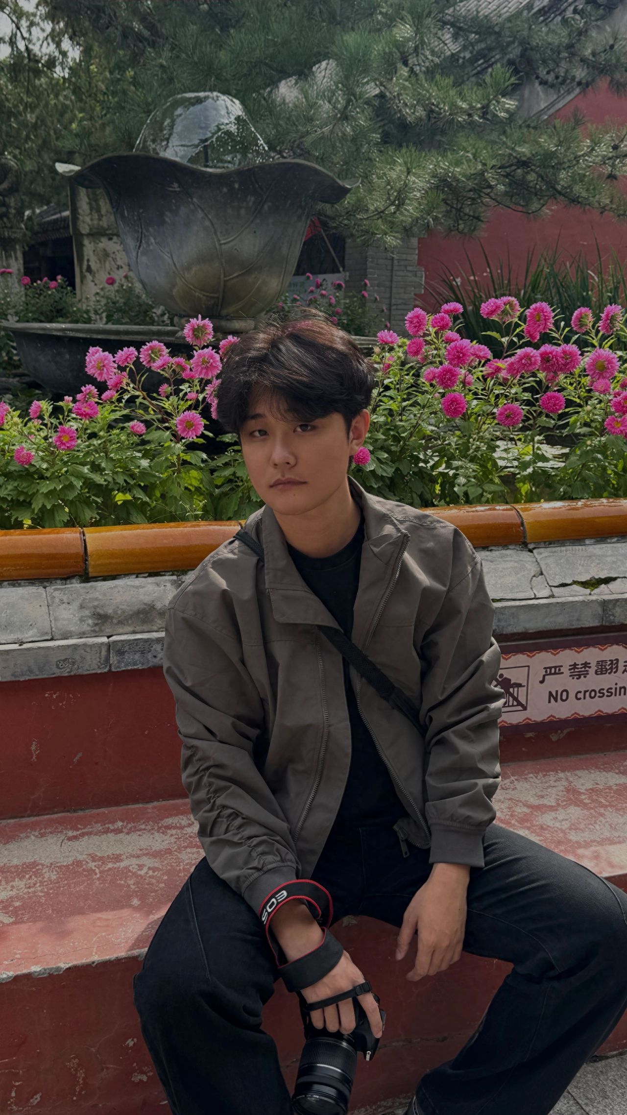 Photo by Tanzhe Temple - Take a photo with the red stone steps and sculptures among the flowers.