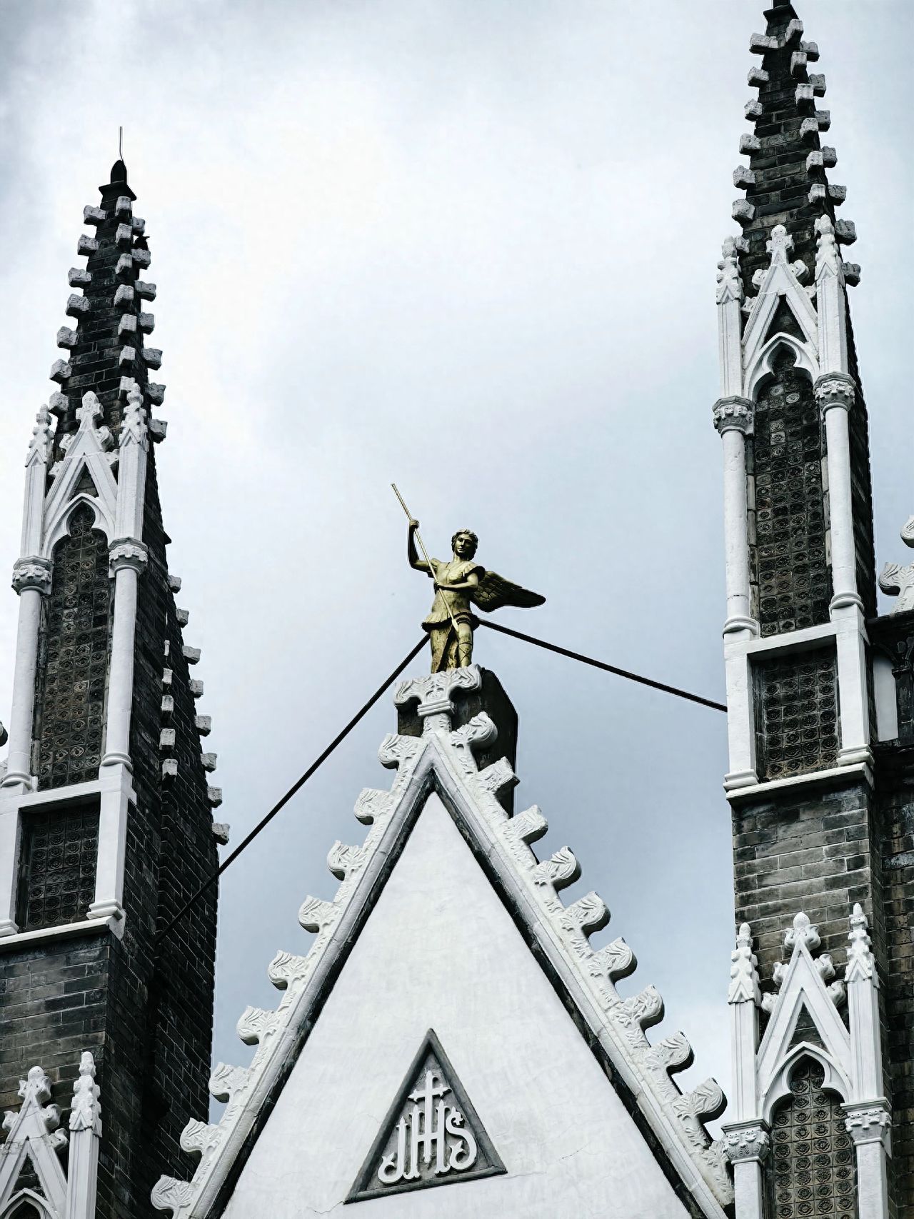 Photo by Xishiku Catholic Church - Capture the top spires and golden sculptures.