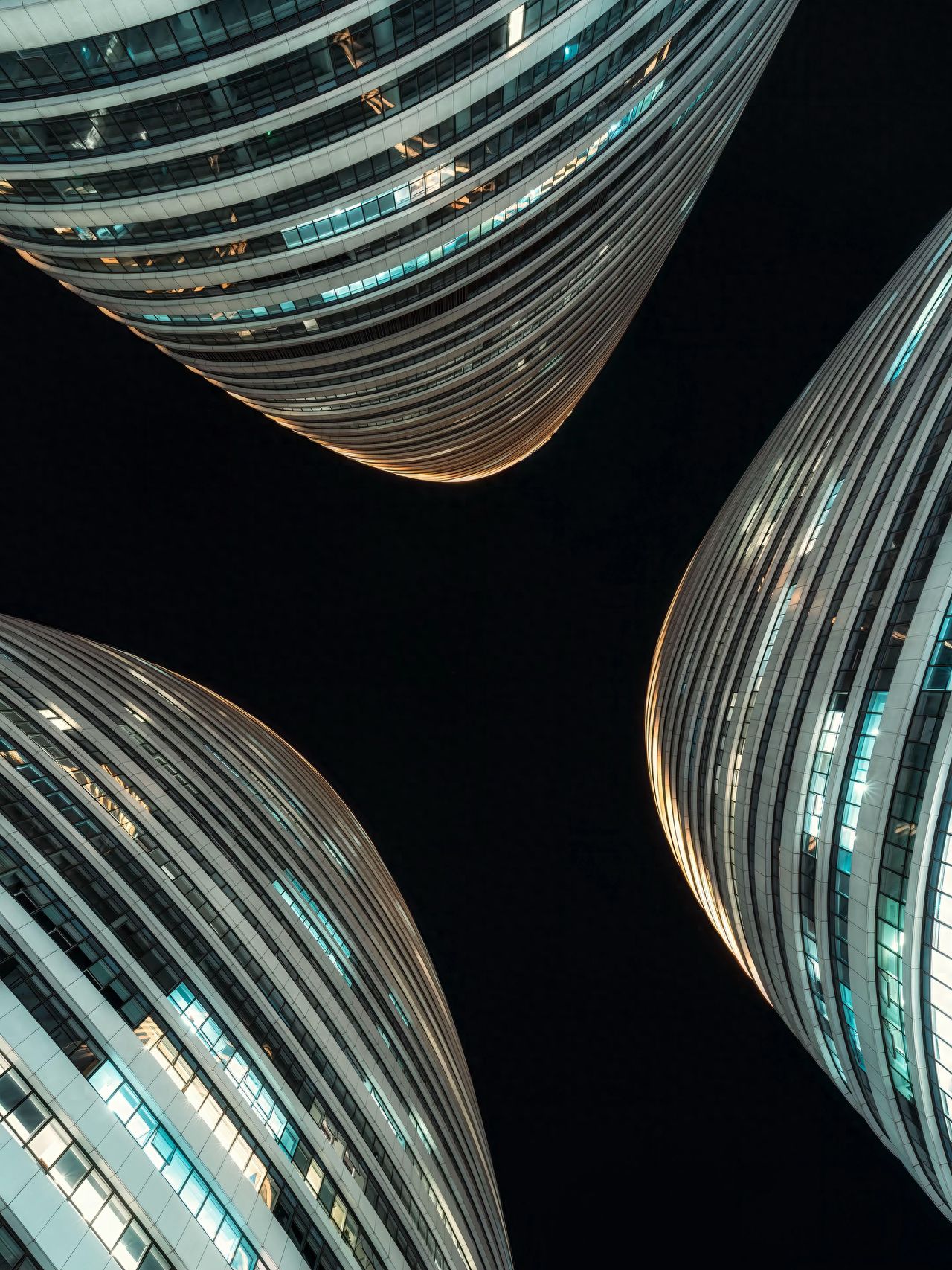 Photo by Wangjing SOHO - Night view of the three tall buildings