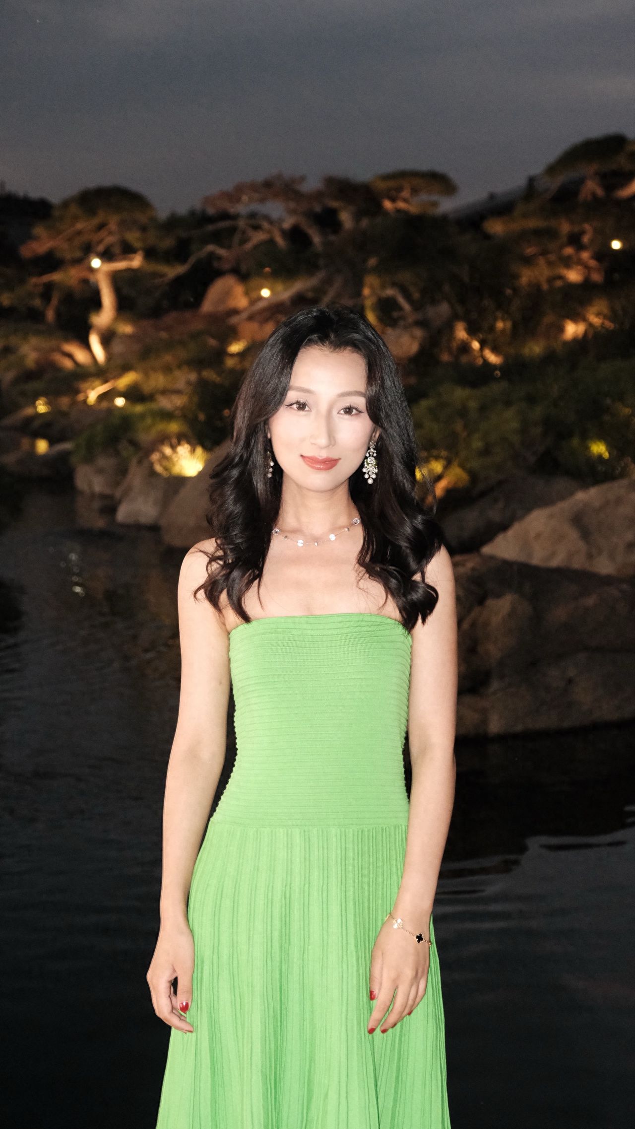 Photo by Luo Hong Photography Art Museum - Take a photo with the night view of waterside greenery.