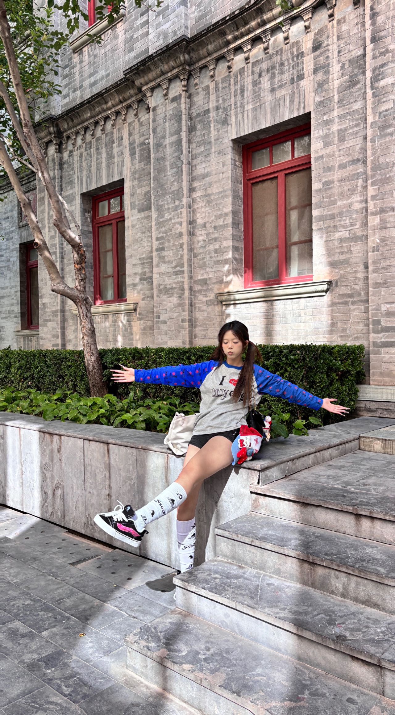 Photo by Qianmen Street - Take a photo with the gray brick walls and red wood window buildings.