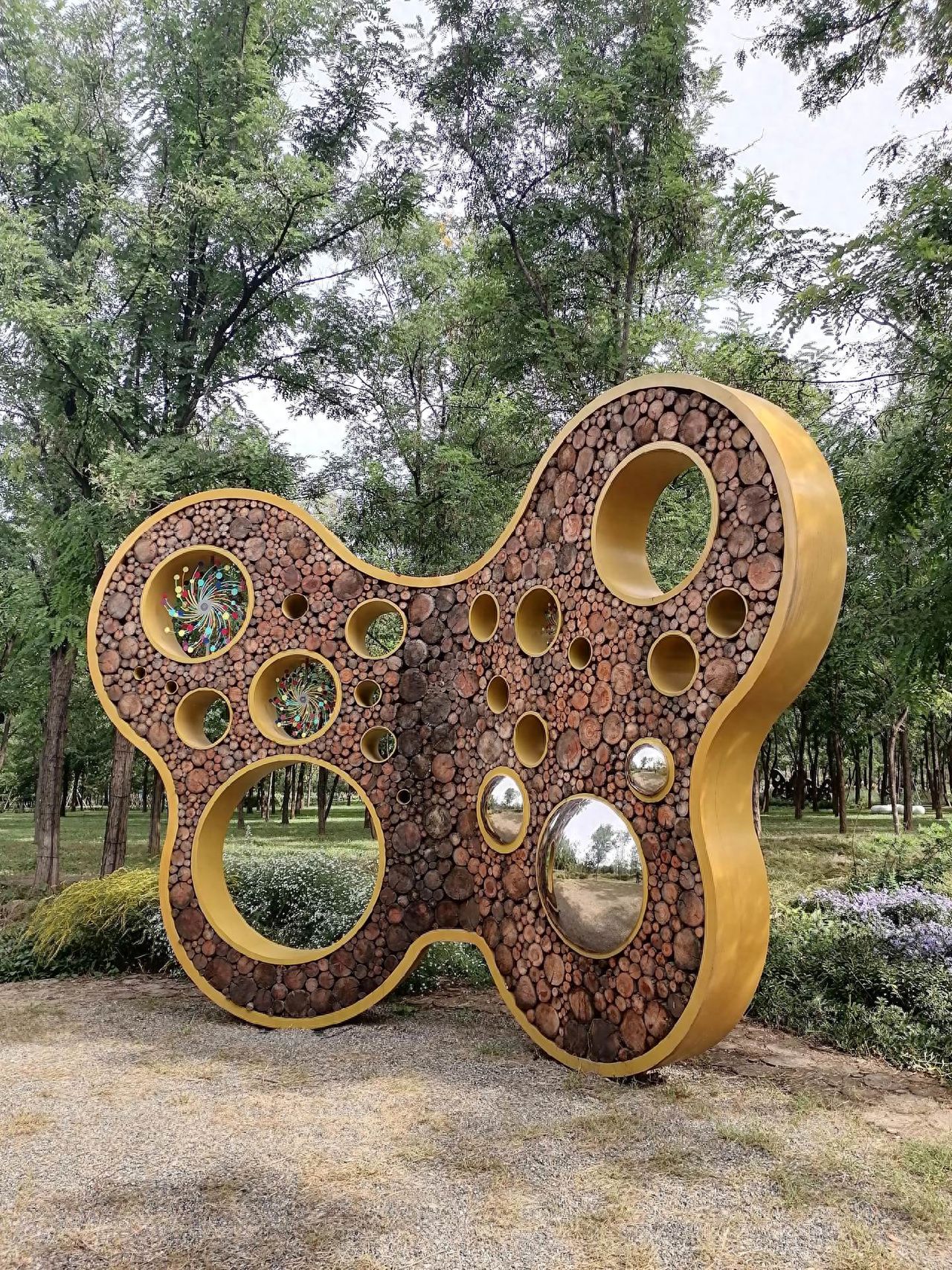 Photo by Beijing Wenyu River Park - Hollow Sculpture Greenery Art Installation