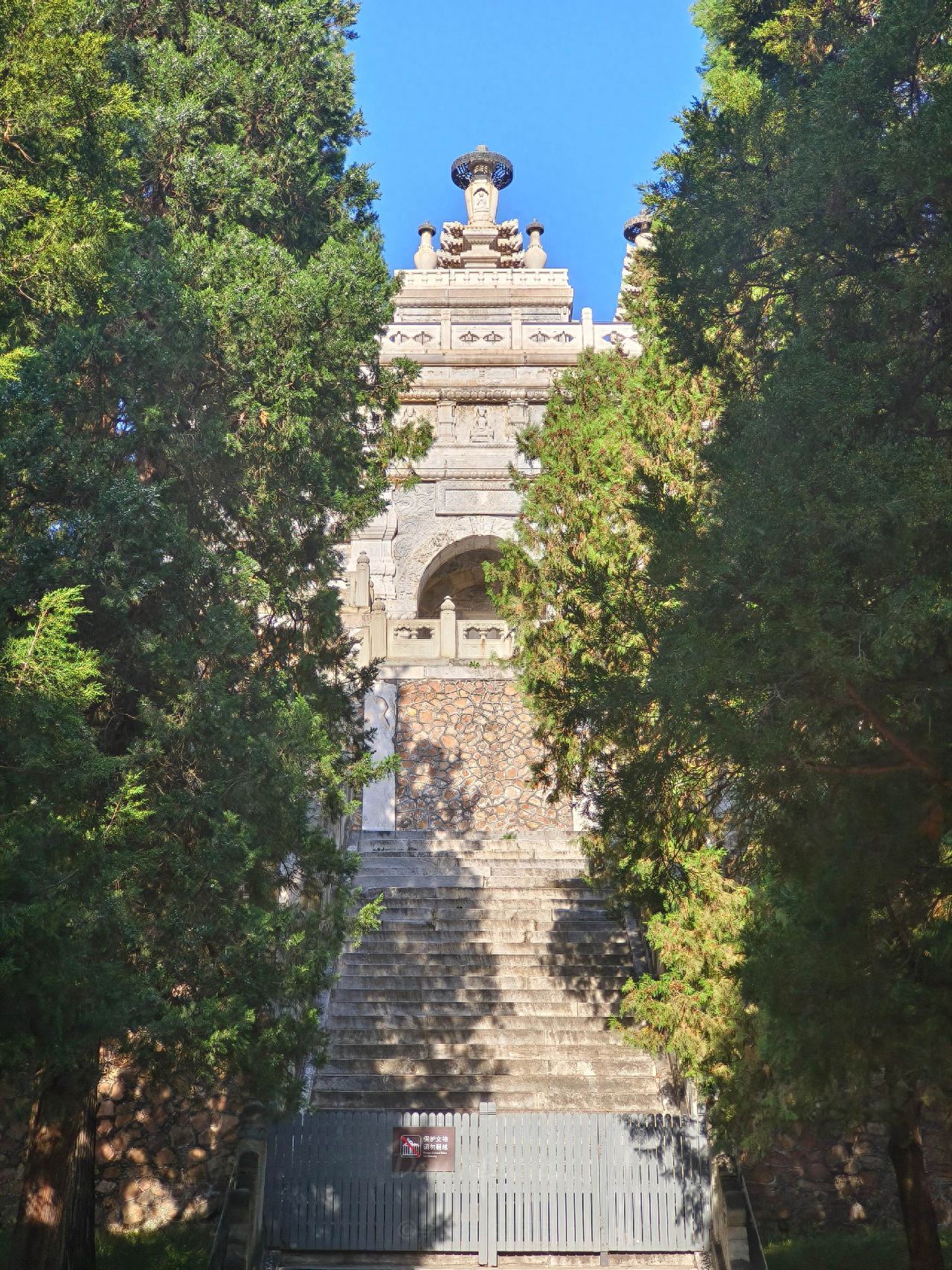 Photo by Beijing Biyun Temple - photograph the green plants on both sides of the stone steps and the stone pagoda.