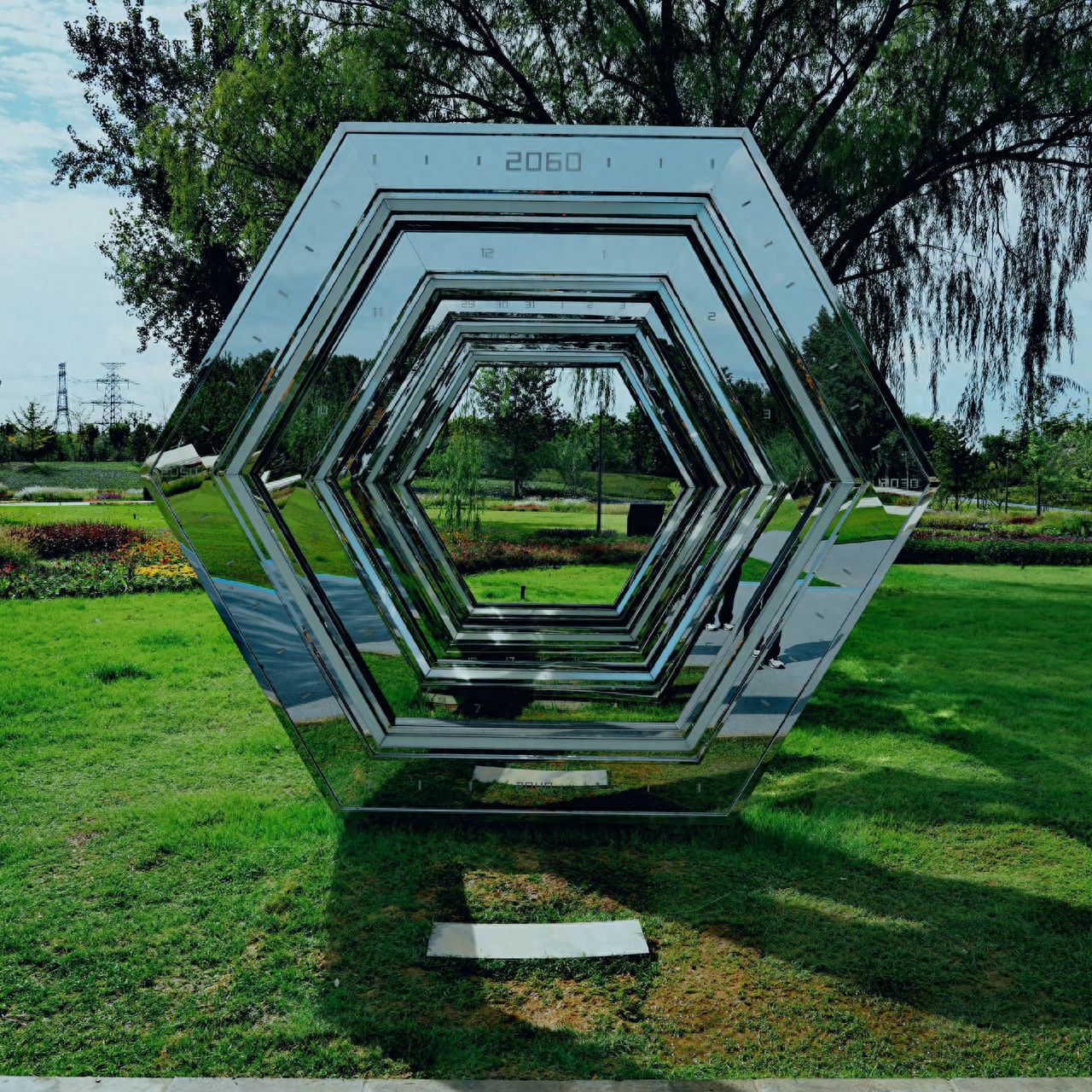 Photo by Beijing Wenyu River Park - Mirrored Hexagonal Art Installation