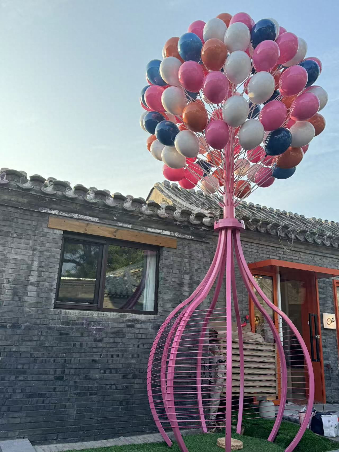 Photo by Romantic Hutong - Large Balloon Installation on Brick Wall Architecture