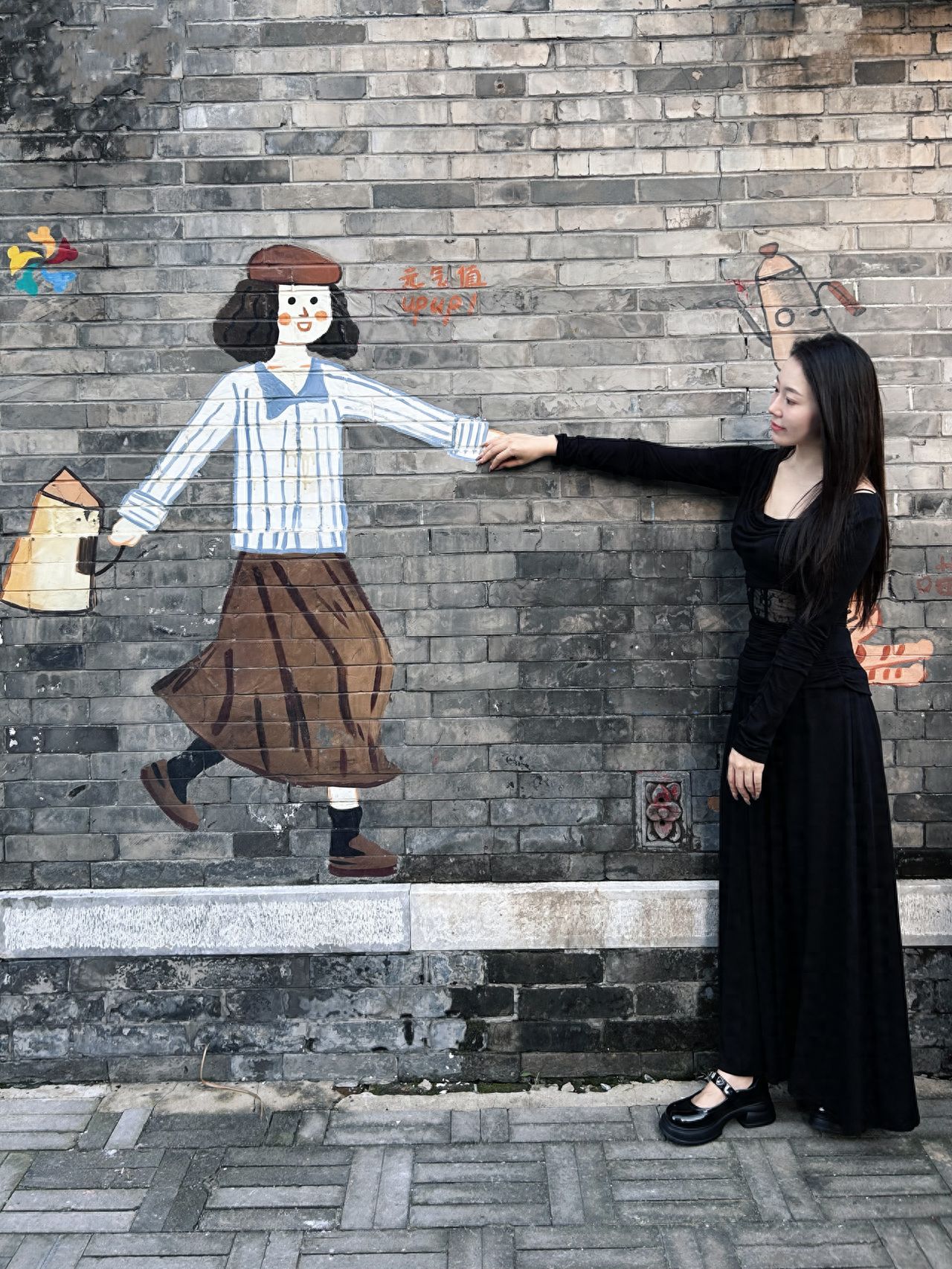 Photo by Nanman Hutong - Hand in Hand Doll Graffiti Wall