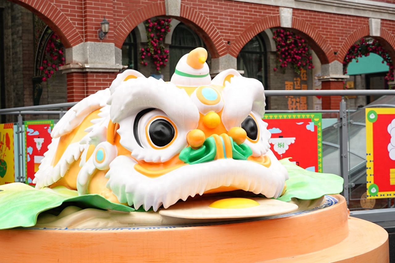 Photo by Qianmen Street, Beijing - Large Lion Dance Head Installation and Architecture