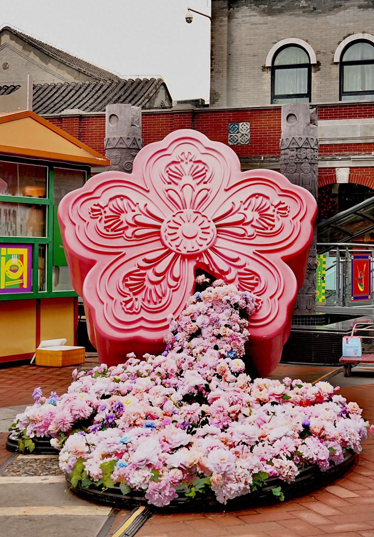 Photo by Qianmen Street in Beijing - Pink Flower-shaped Installation