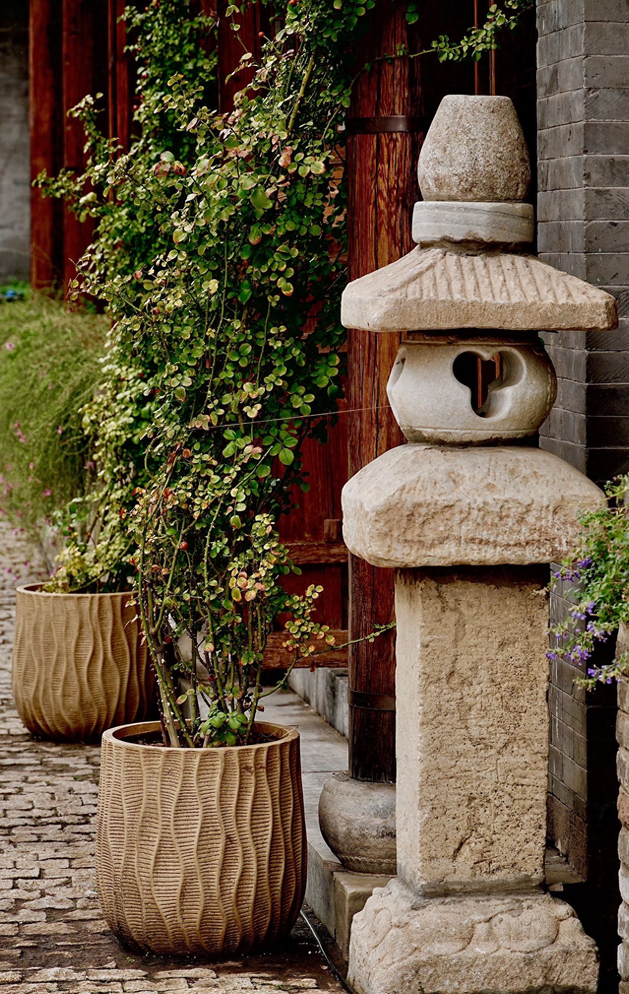Photo by Qianmen Street in Beijing - Stone Lanterns and Architectural Potted Plants