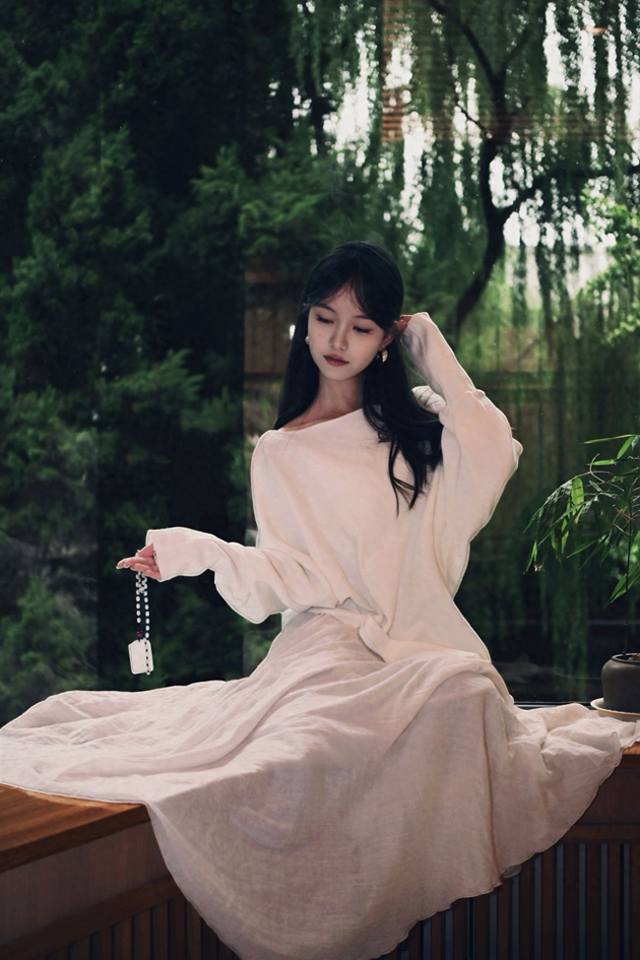 Photo by Capital Hotel Beijing - Take a photo with benches and green trees.