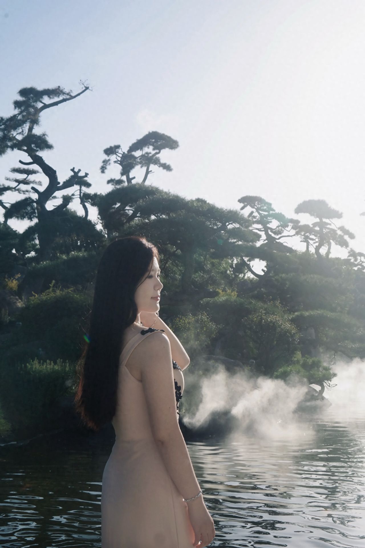 Photo by Luo Hong Photography Art Museum - Take a photo with waterside trees and green plants.
