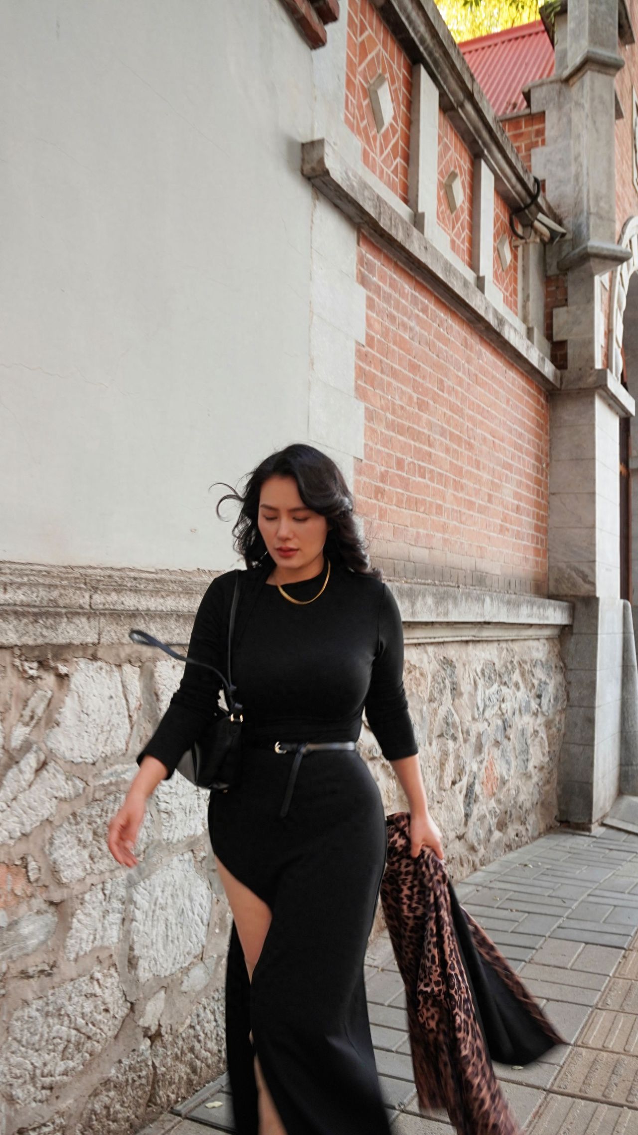 Photo by Dongjiaomin Alley – Photo with Red Brick, White Walls, Stone Columns, and Cobblestone Path