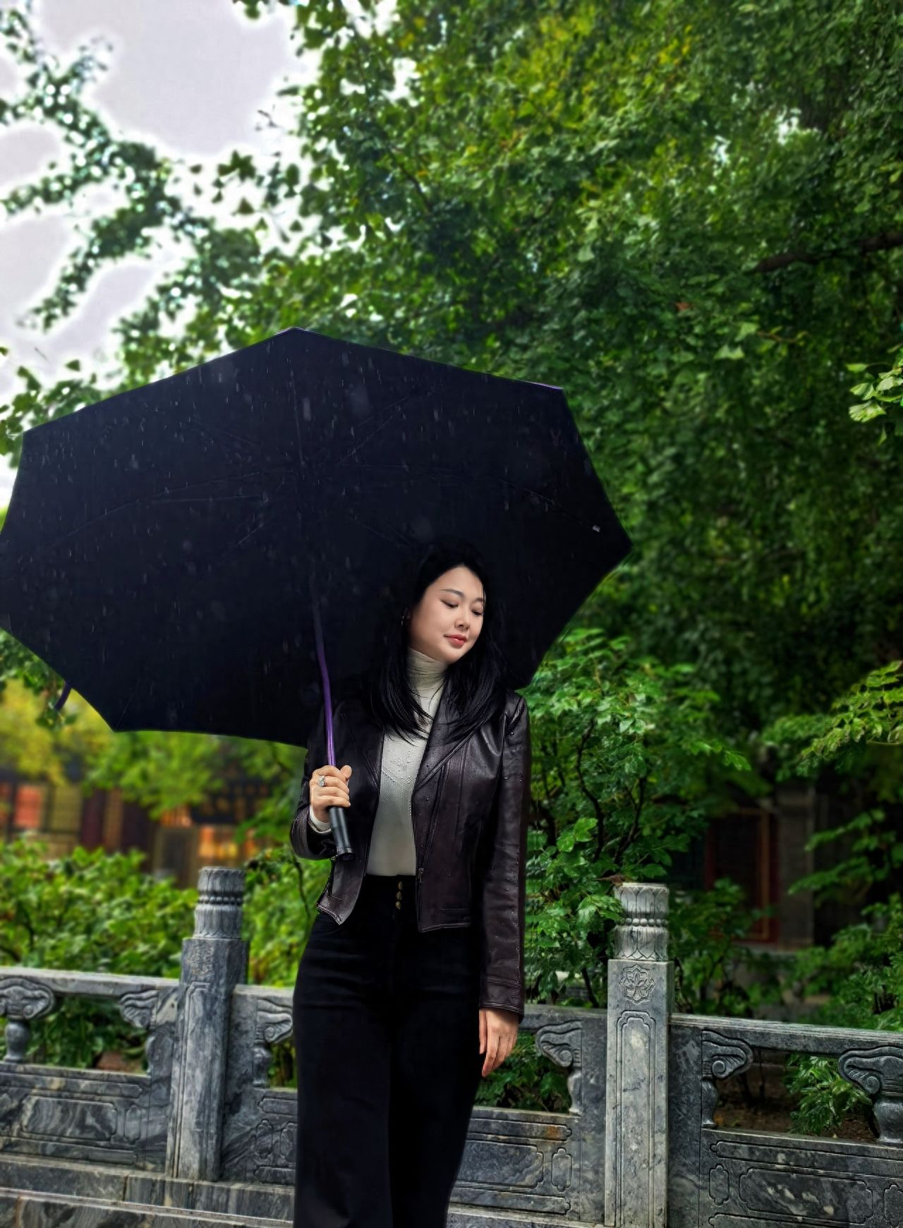 Photo by Take a photo with the stone bridge railing and green plants at Tanzhe Temple.